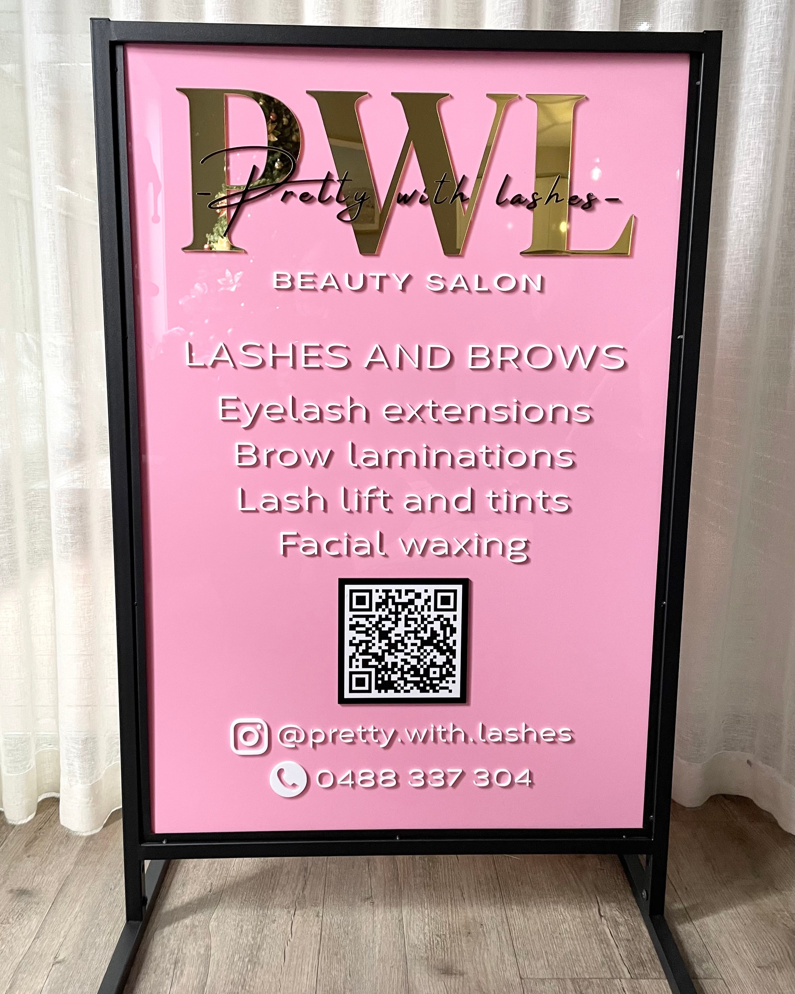 Pink branded acrylic T frame sign for lash and brow menu