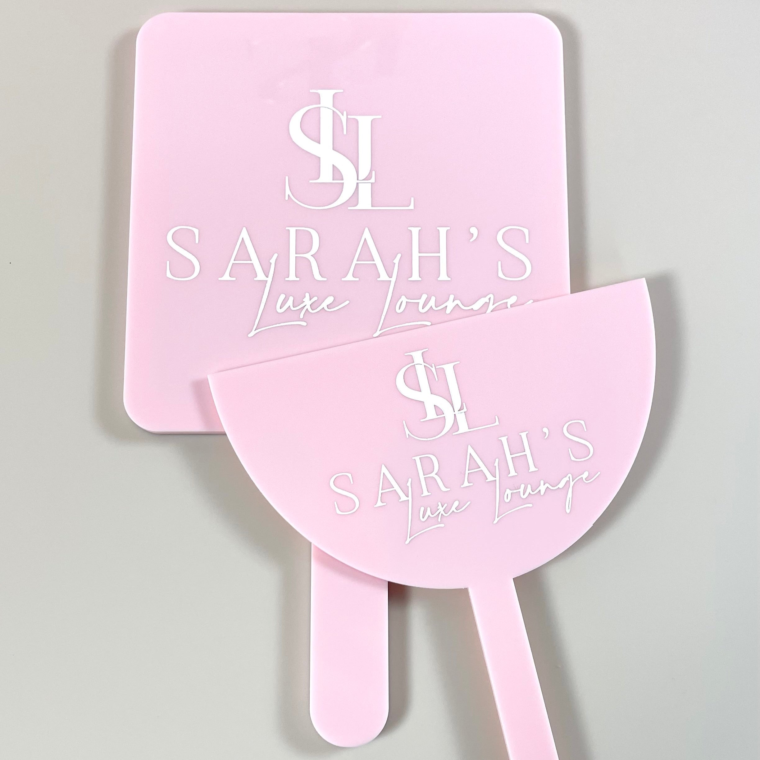 Branded pastel pink mirror and face shield with Sarah S beauty salon logo