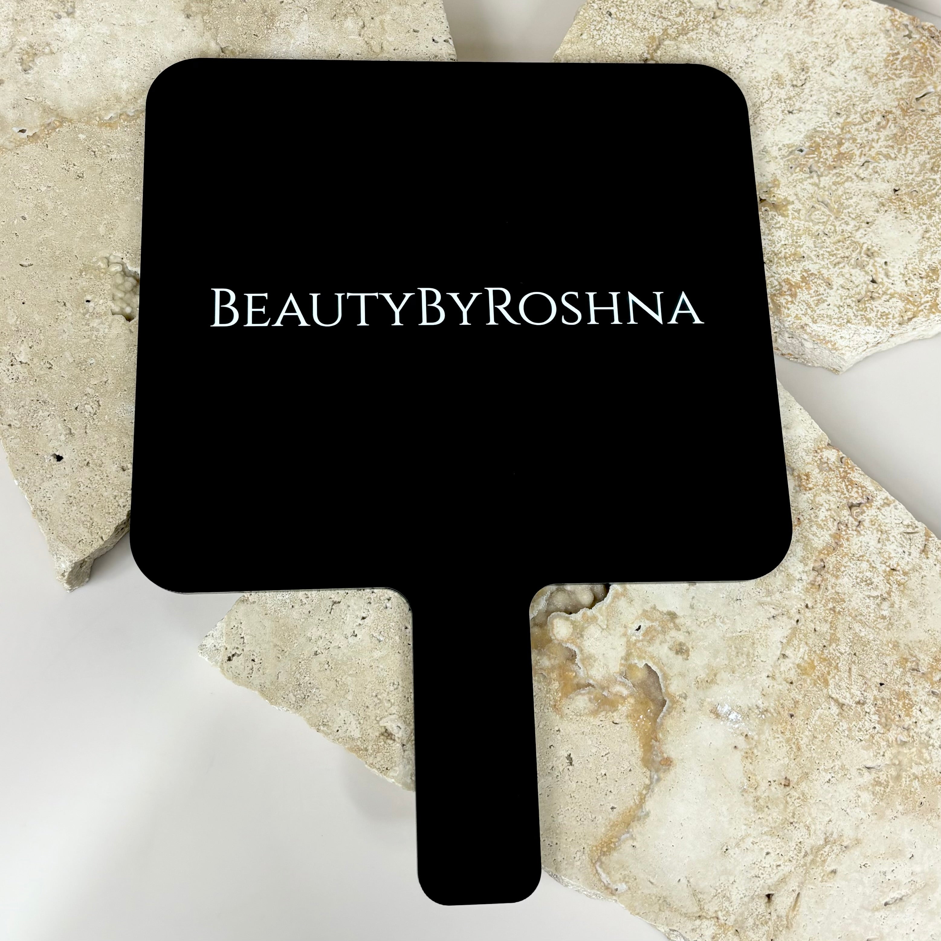 Black square mirror with Beauty by Roshina logo