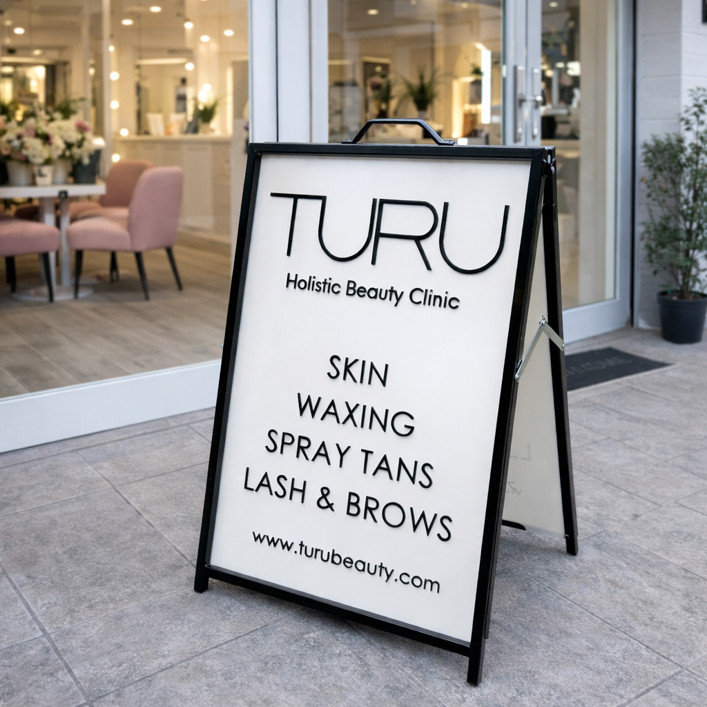 A frame footpath sign outside a beauty clinic featuring a custom branded acrylic insert, ideal for salon advertising, storefront signage and attracting walk-in clients