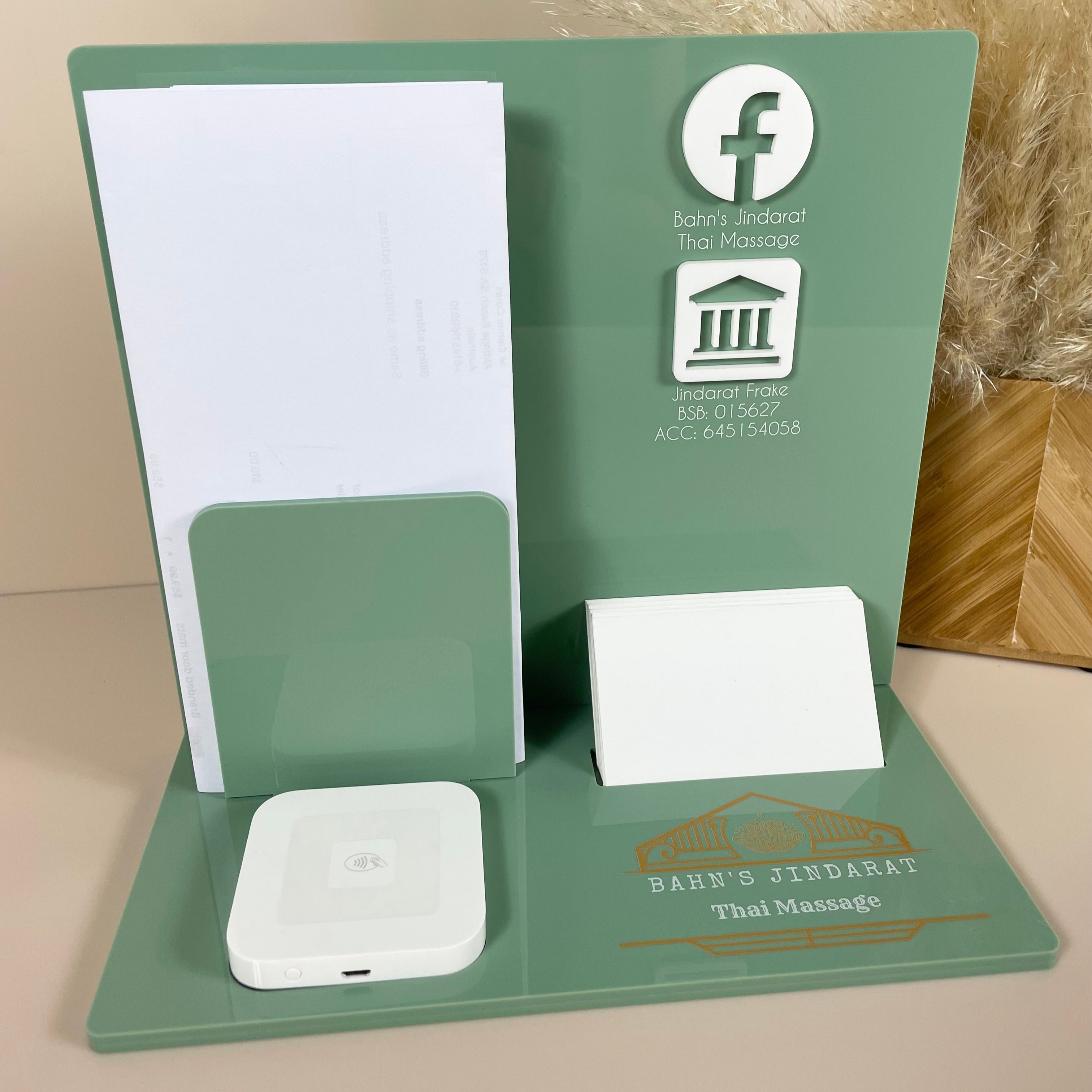 Green and white reception counter stand with custom logo and price list holder