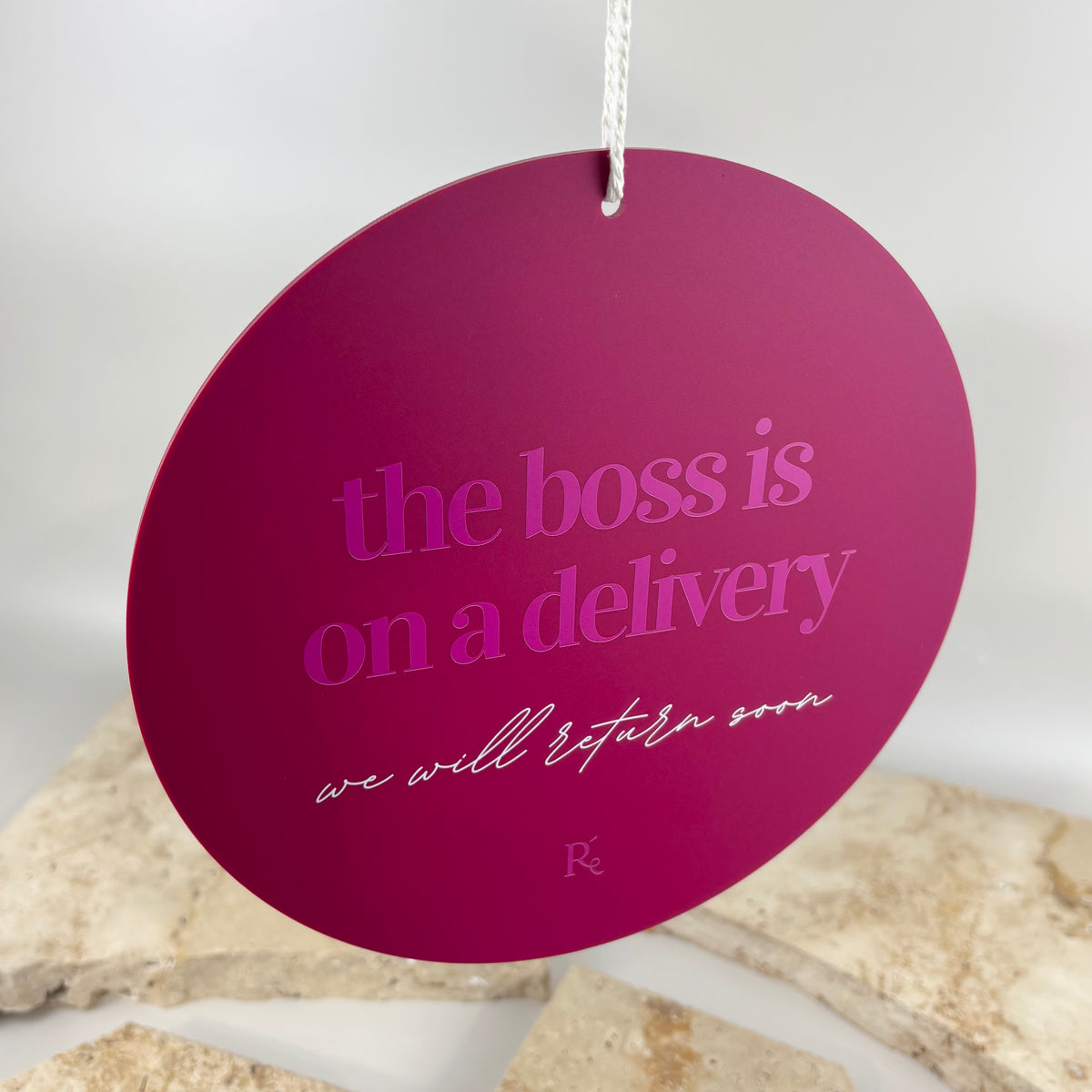Round acrylic “the boss is on a delivery, we will return soon” hanging business door sign for shops, salons and small businesses.
