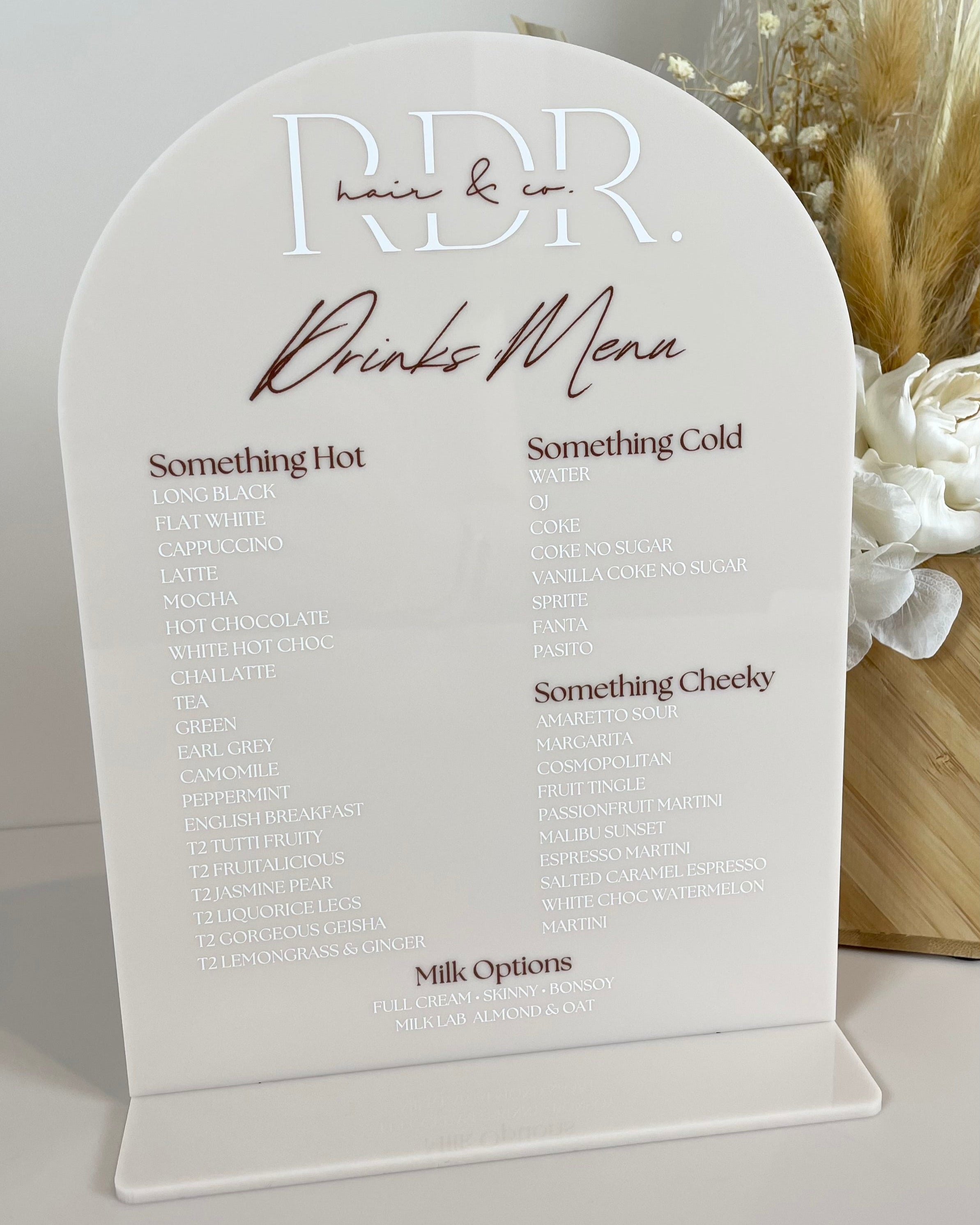 Personalised salon drink menu in arched acrylic with custom layout