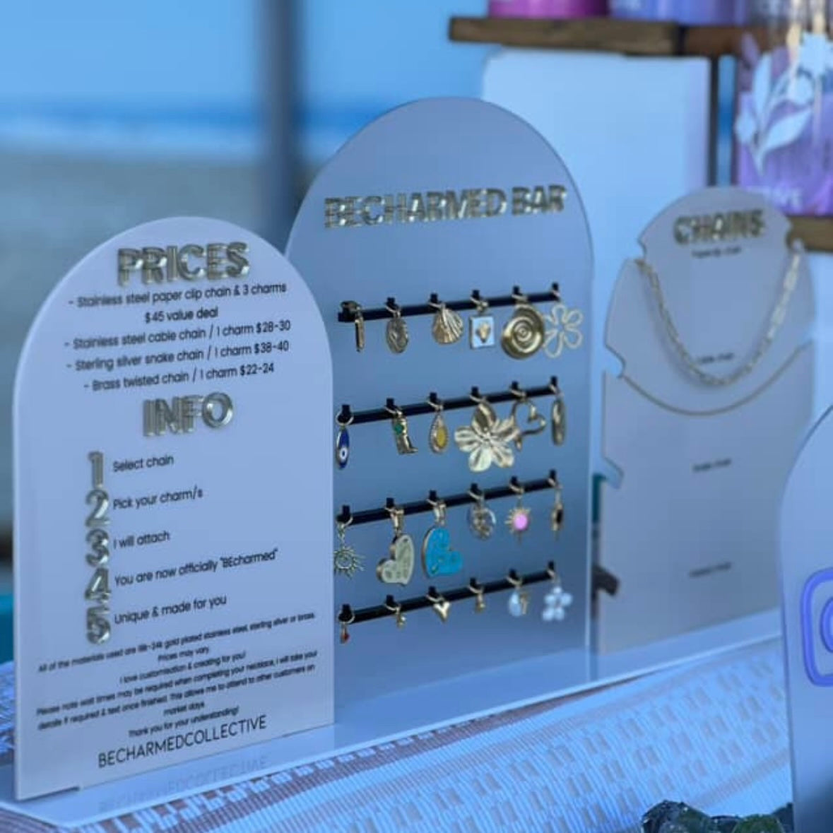 Custom acrylic display stands for jewellery business, including price list sign, charm display board and product signage, designed for retail counters, markets and boutique setups Australia