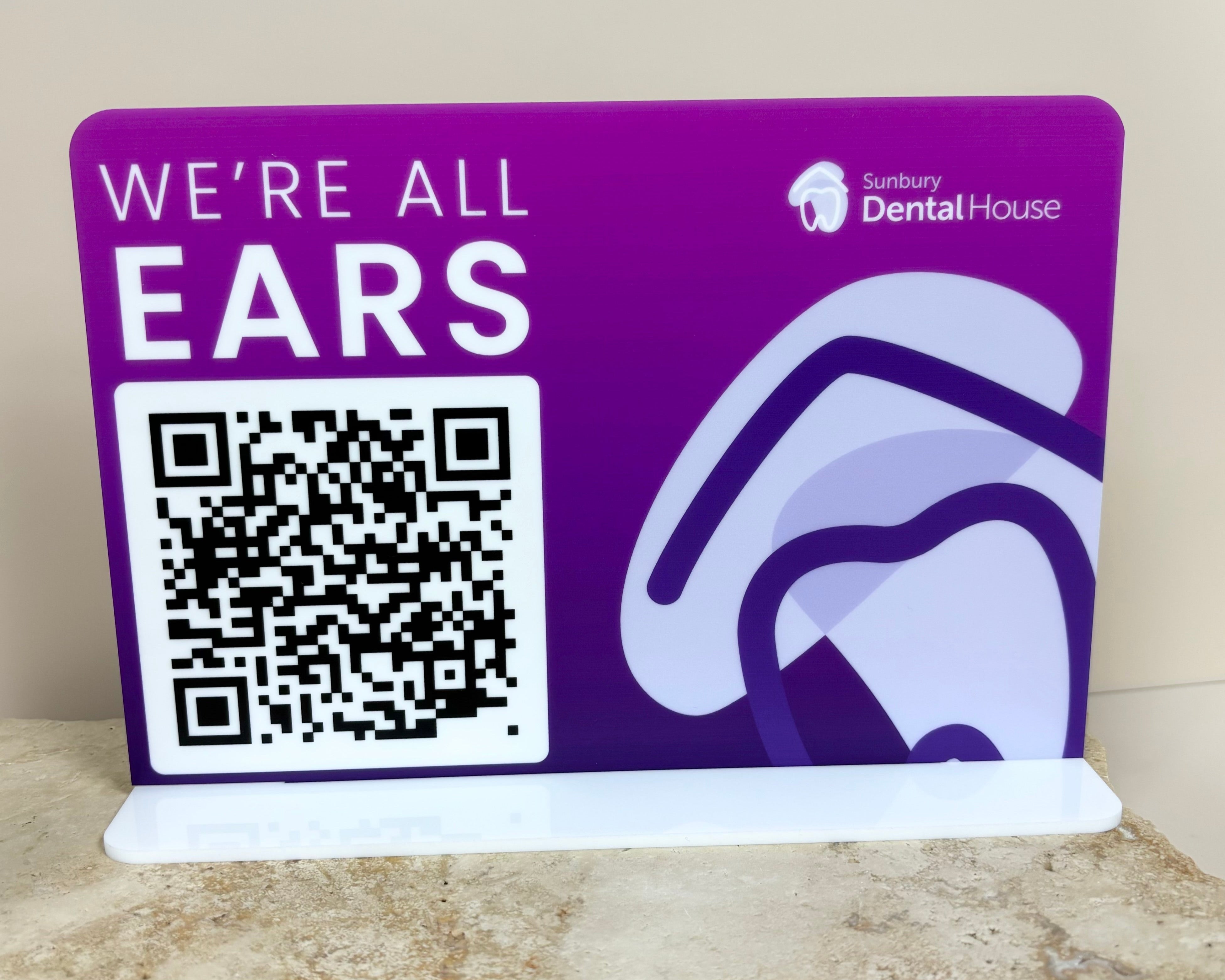 Purple acrylic sign with QR code for feedback or review submission