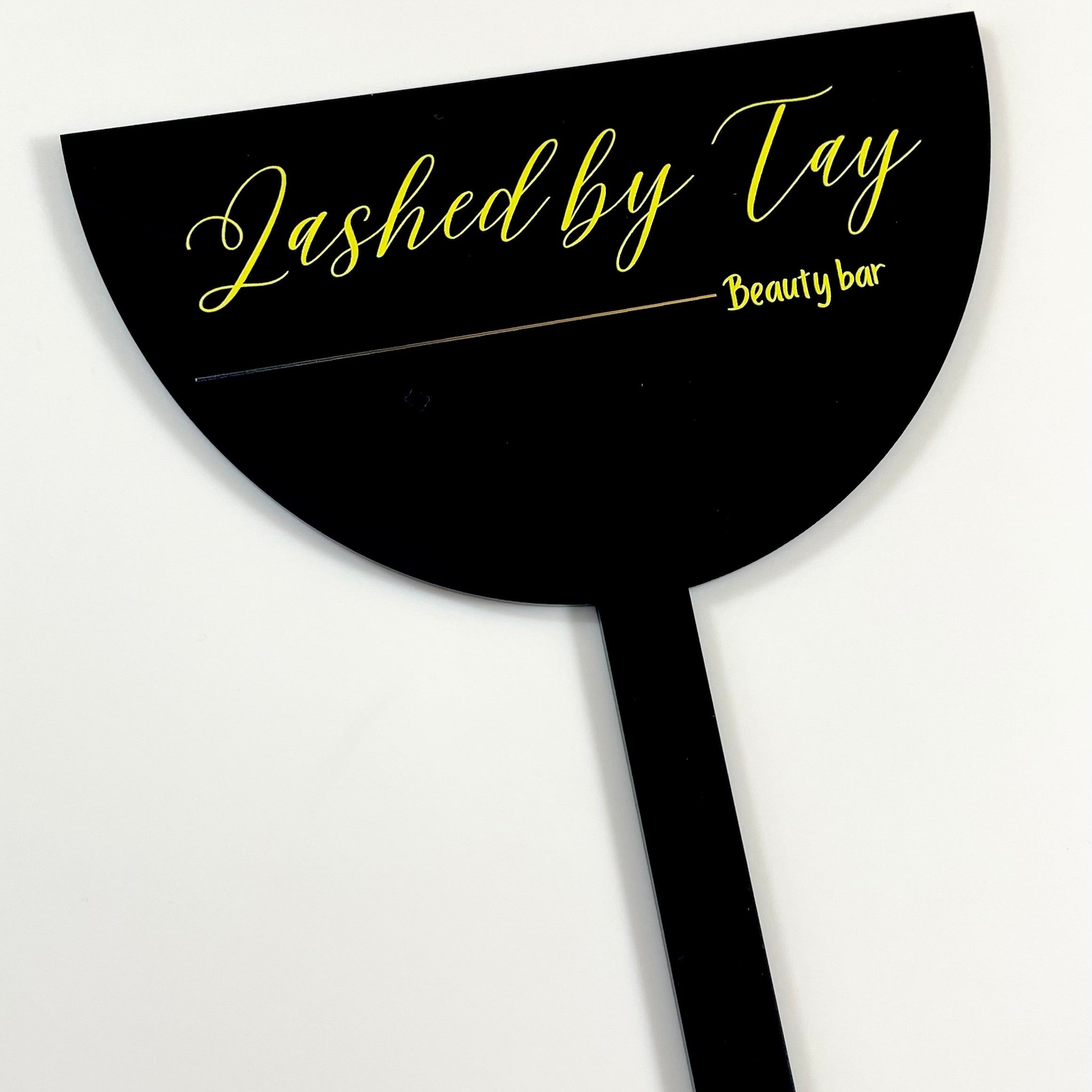 Black branded face shield with Lashed by Tay logo for lash technicians