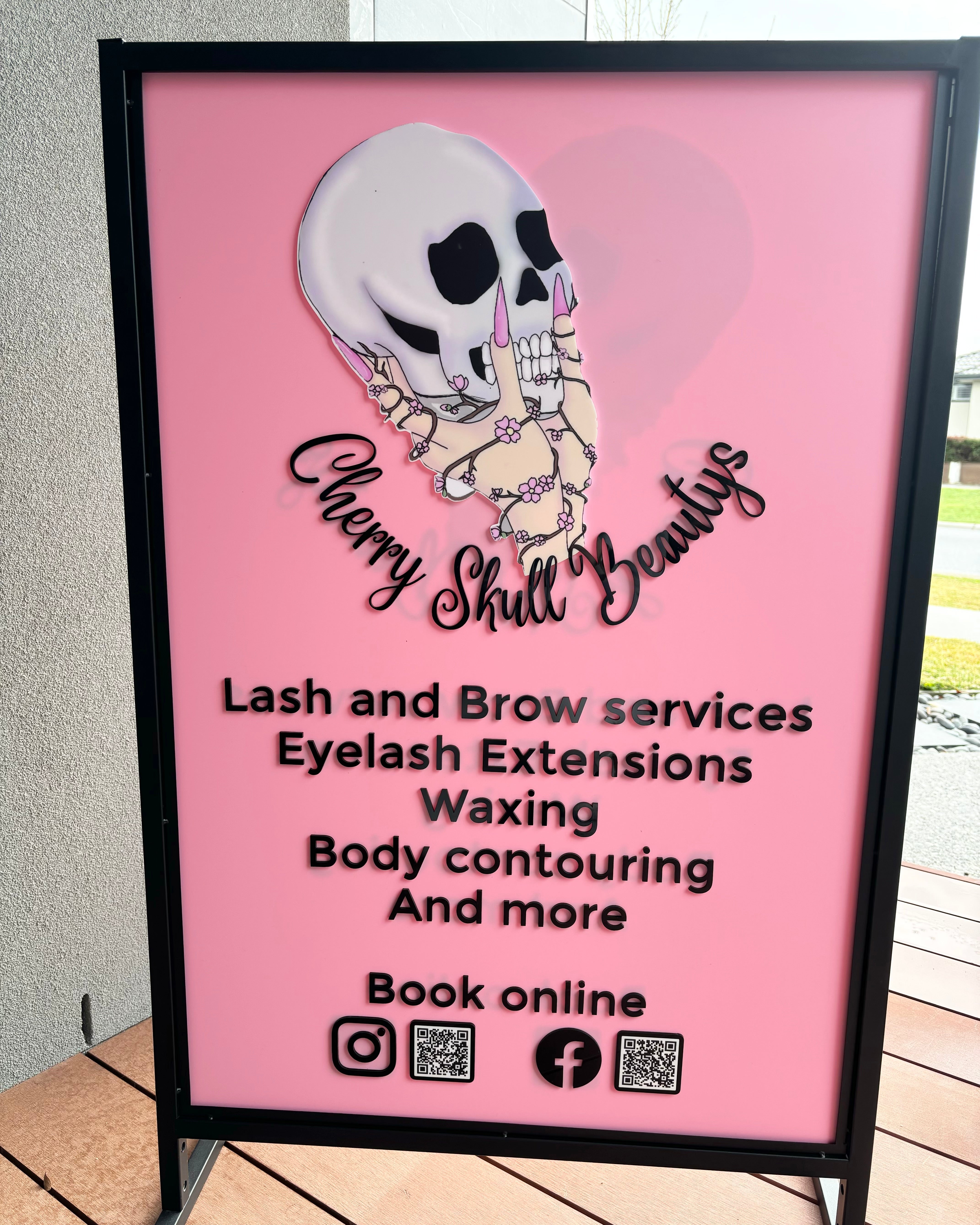 Pink outdoor T frame sign with lash and brow services