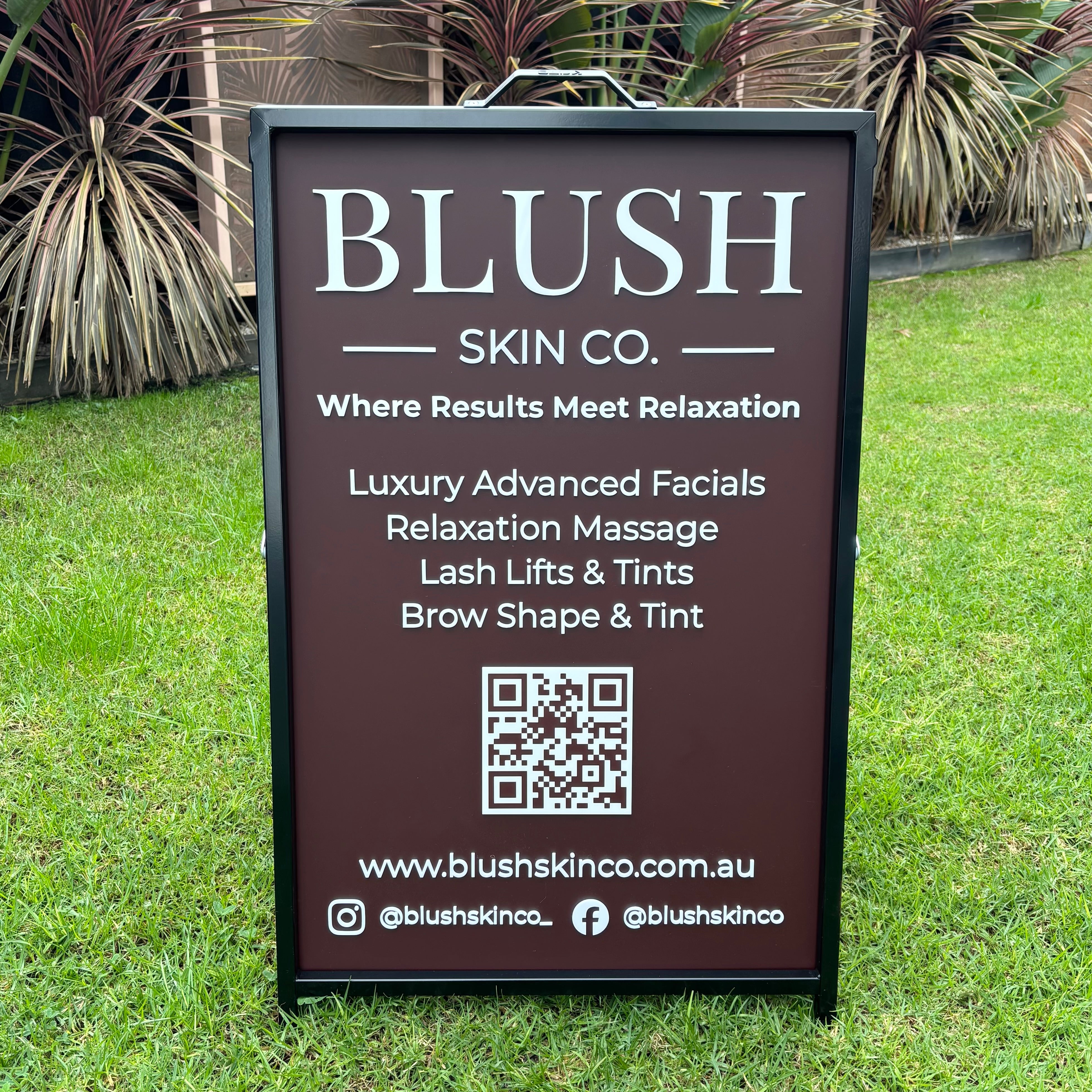 Custom A-frame pavement business sign with logo, services and QR code, personalised outdoor sidewalk signage for beauty salons, skin clinics, shops and small businesses.