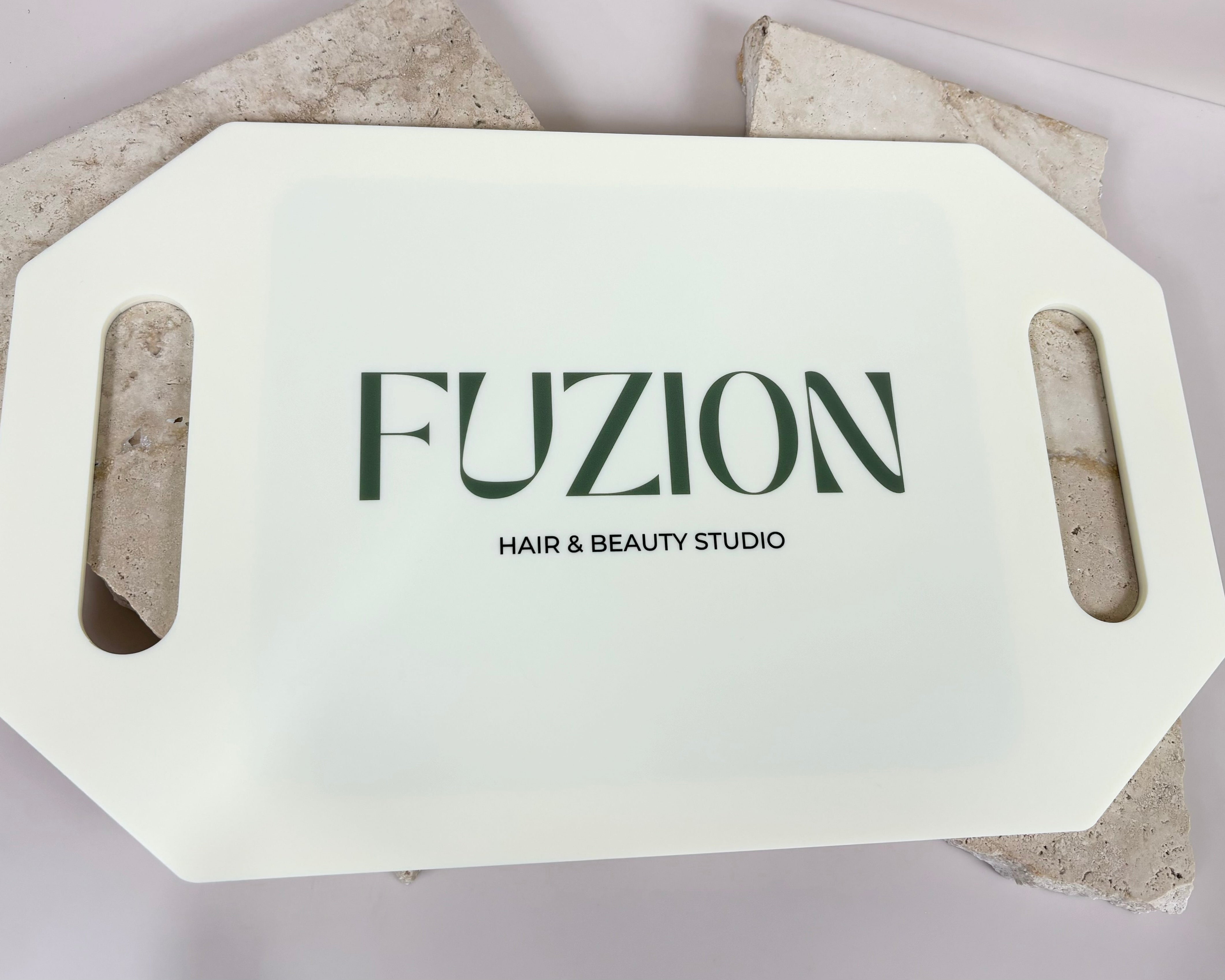 White rectangular salon mirror with Fuzion Hair and Beauty Studio branding
