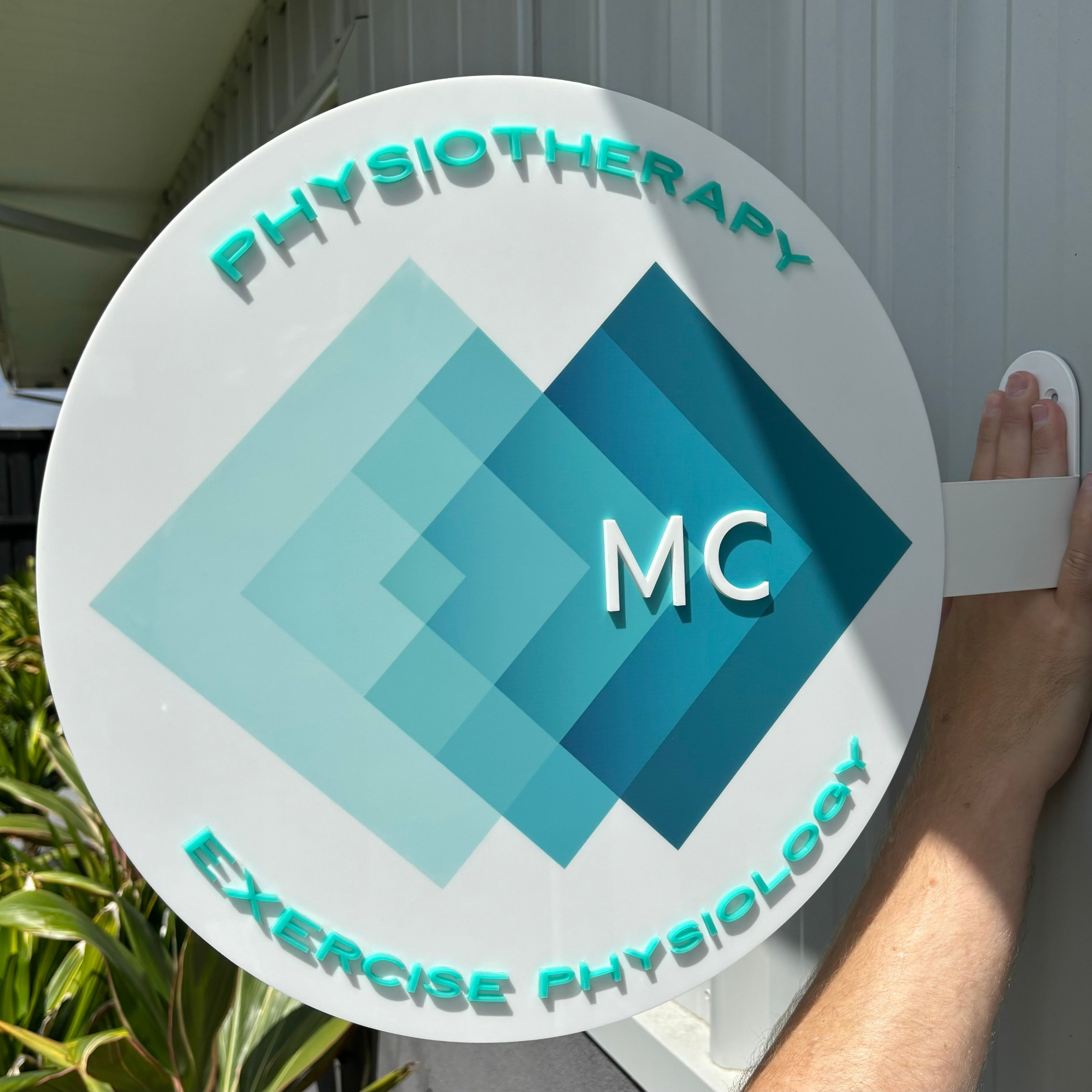 MC Physiotherapy geometric logo round blade sign