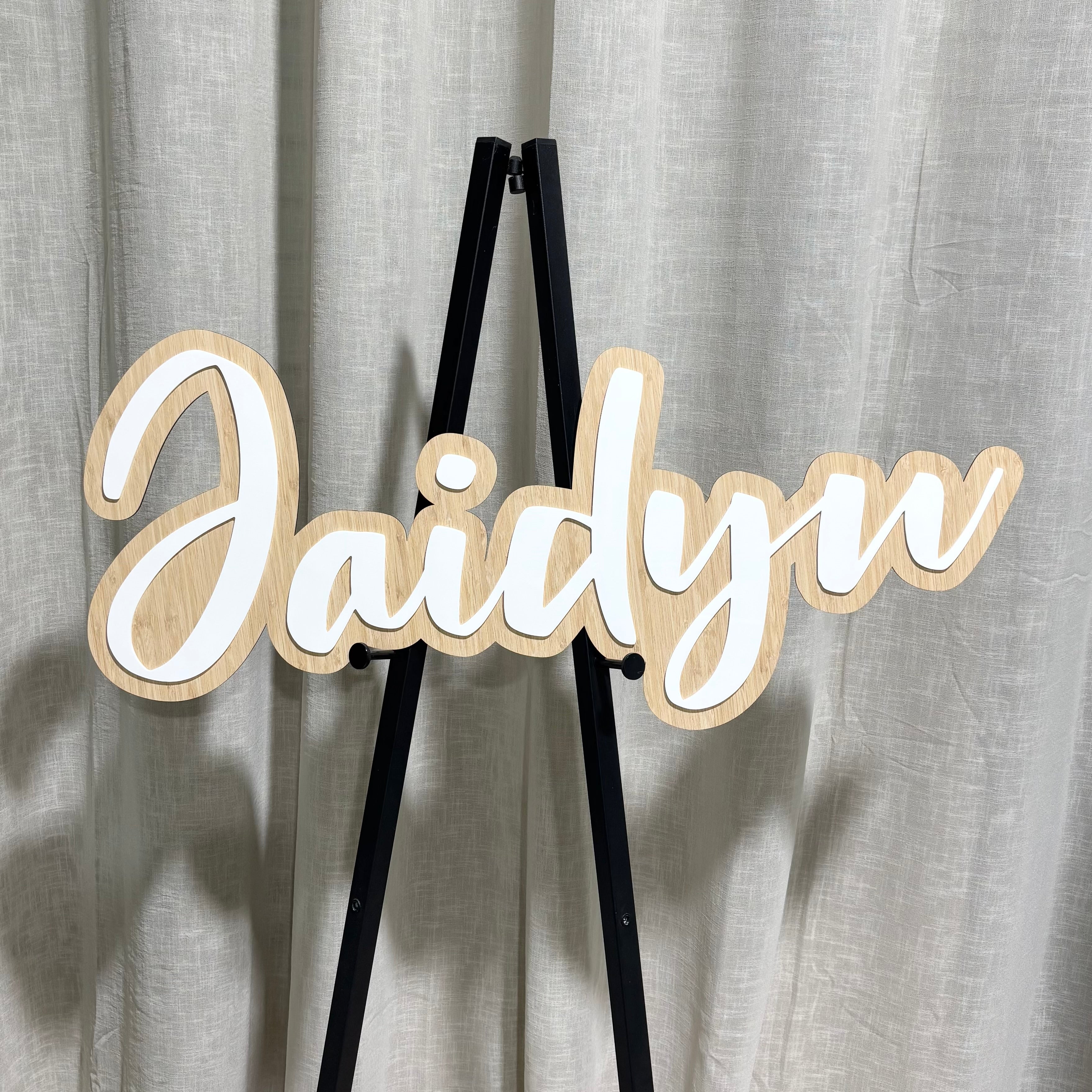 Custom bamboo and acrylic name plaque with layered 3D lettering, personalised script wall sign for bedrooms, nurseries and events, premium laser cut timber backing with raised white acrylic name, Australian made custom decor.