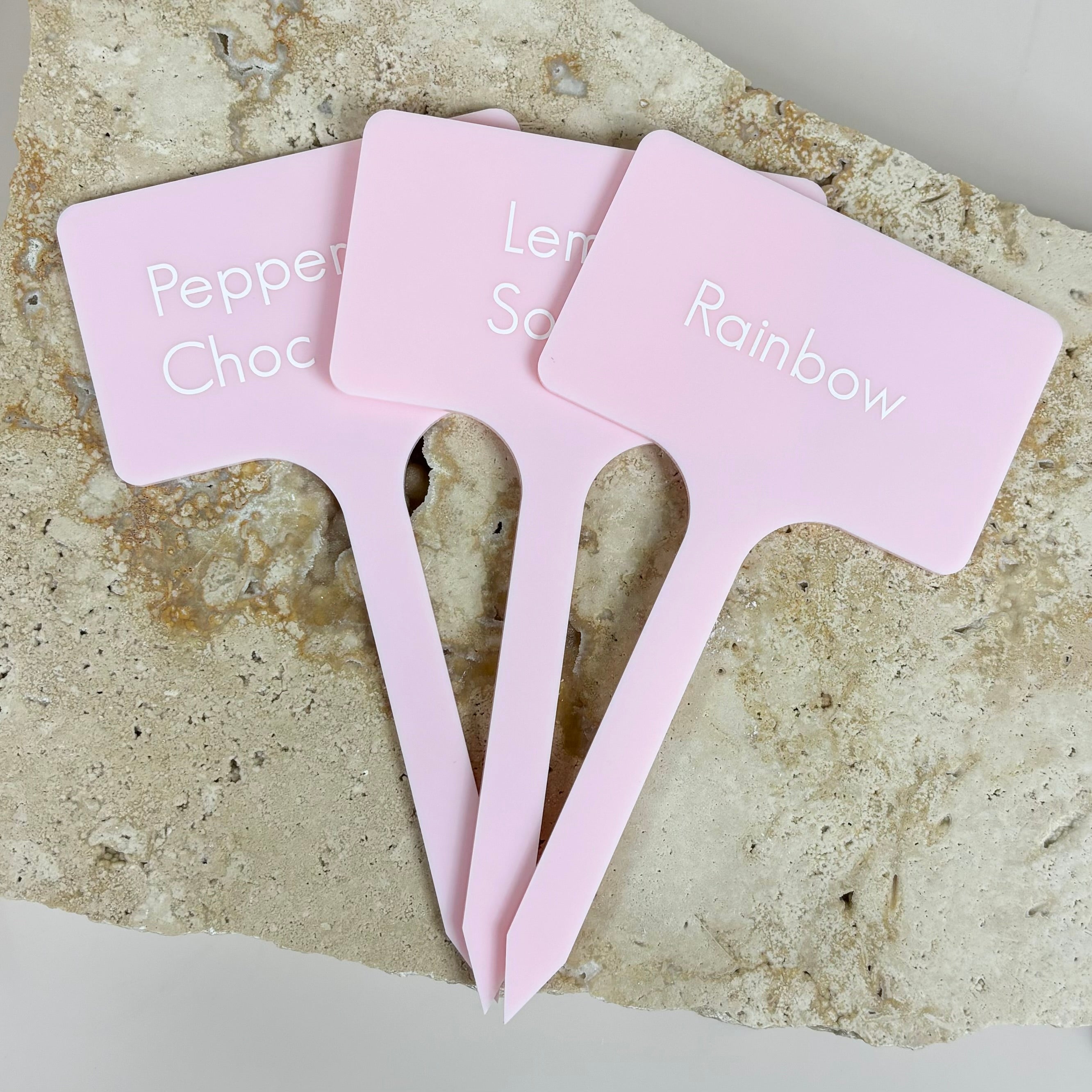 Multiple pink custom food label sticks for gelato and sorbet varieties