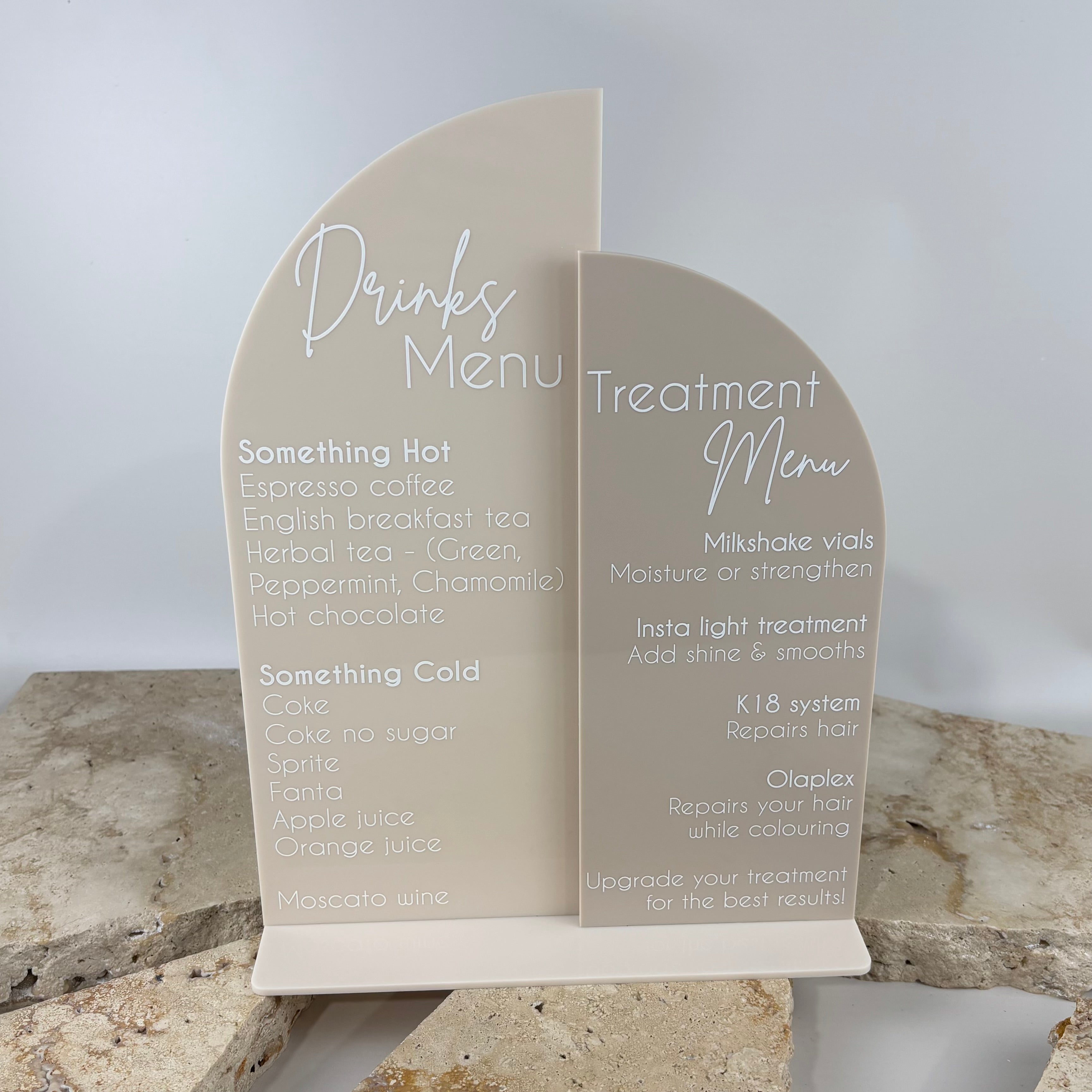 Custom acrylic drinks and treatment menu stand with layered arch design, freestanding salon menu display for beverages and services, personalised countertop signage for hair salons, beauty clinics and reception areas