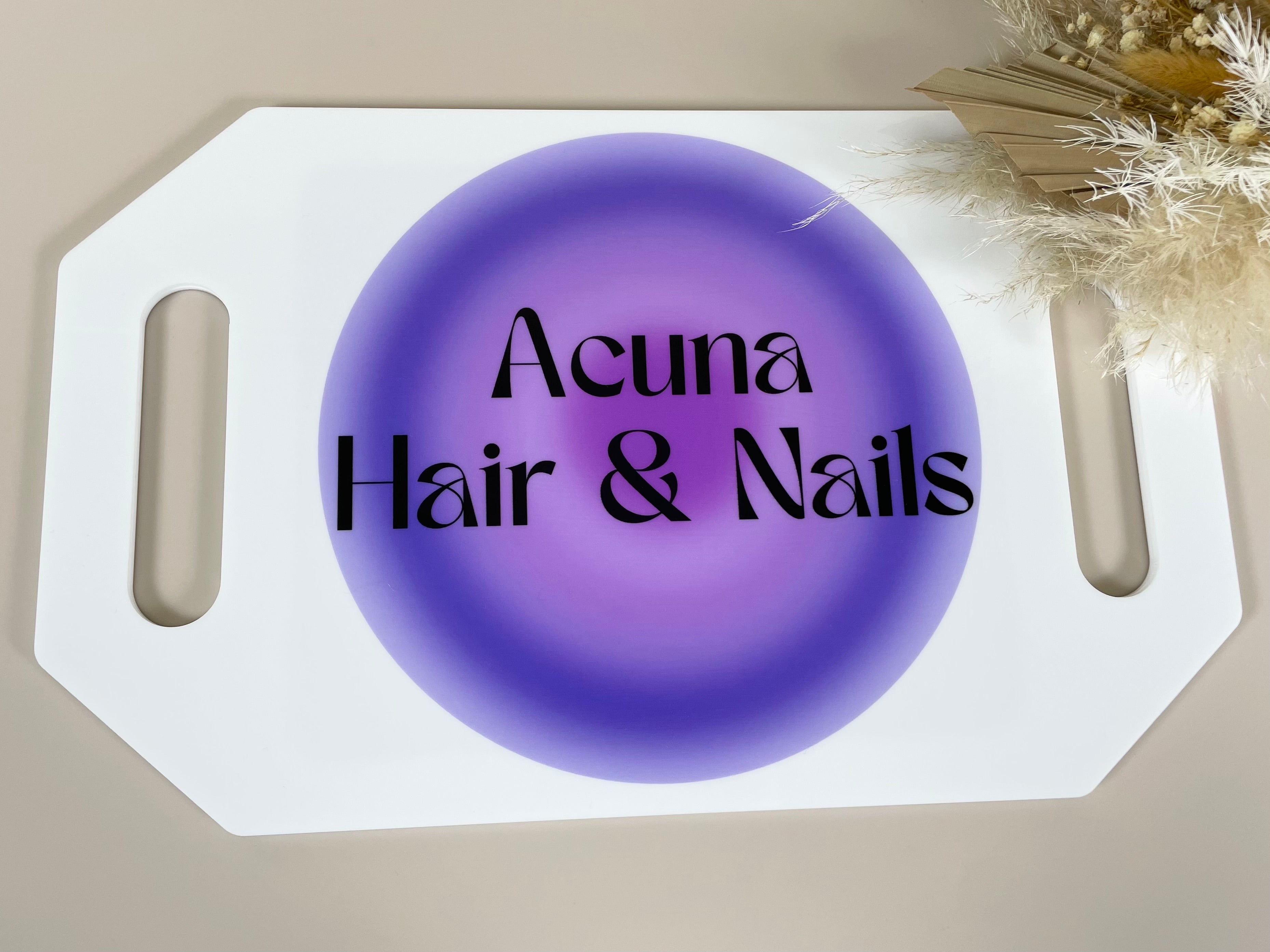 Branded hairdresser mirror with Acuna Hair and Nails logo in purple