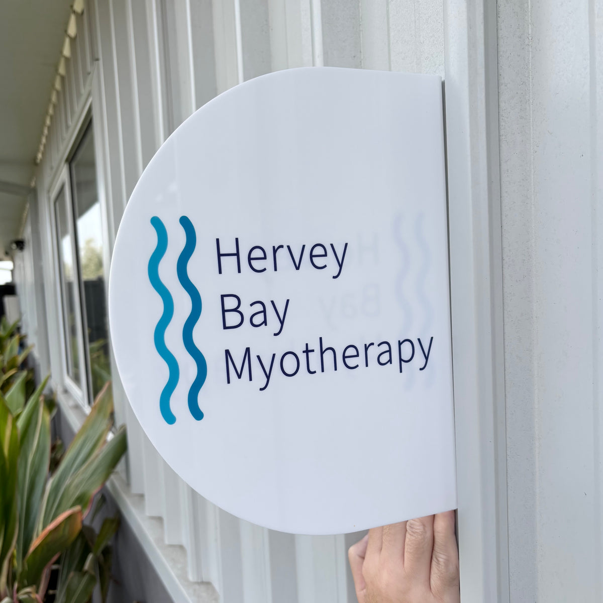 Custom UV printed acrylic blade sign with business logo, personalised double sided wall mounted outdoor sign for clinics, healthcare and professional businesses.