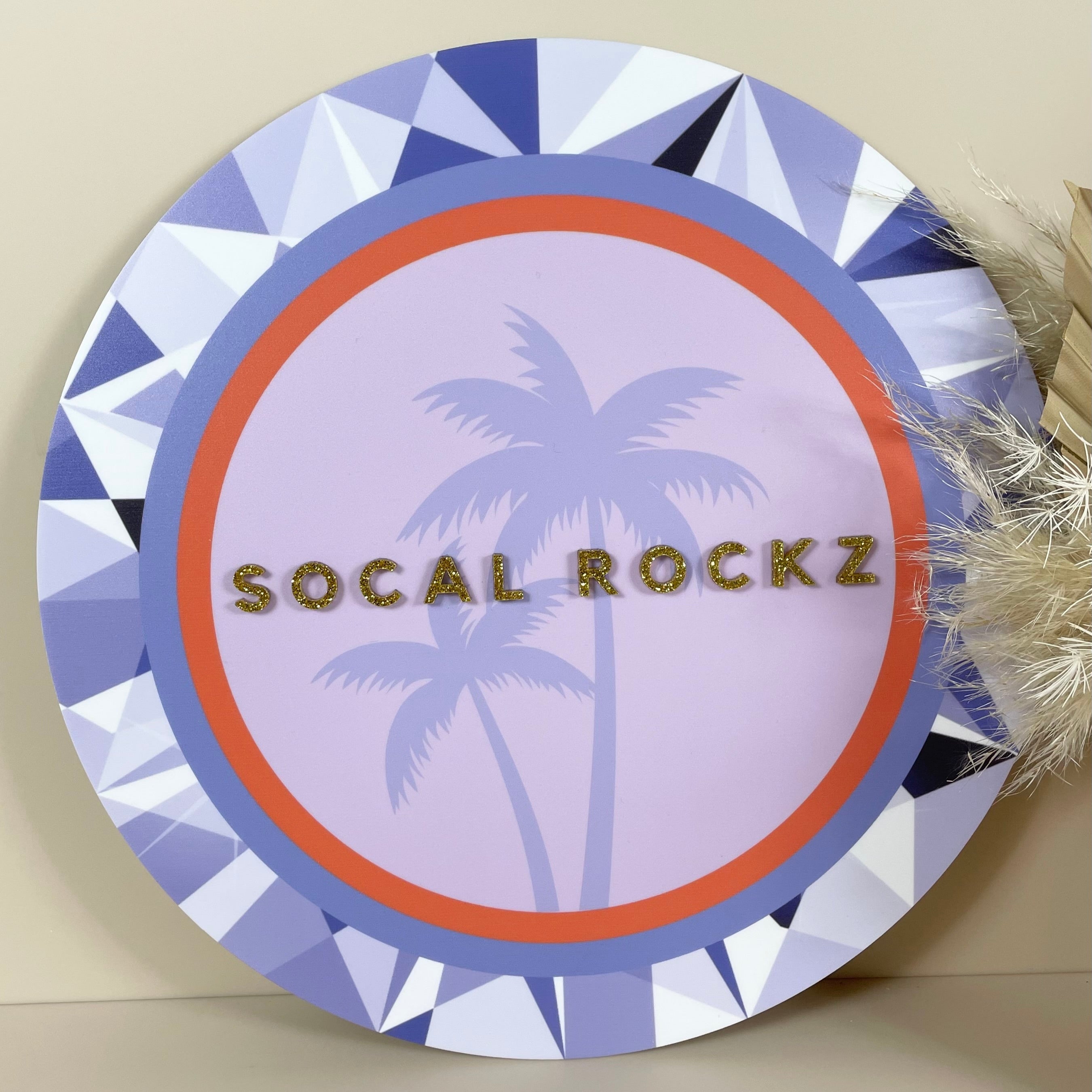 Retro-inspired circular sign for Socal Rockz