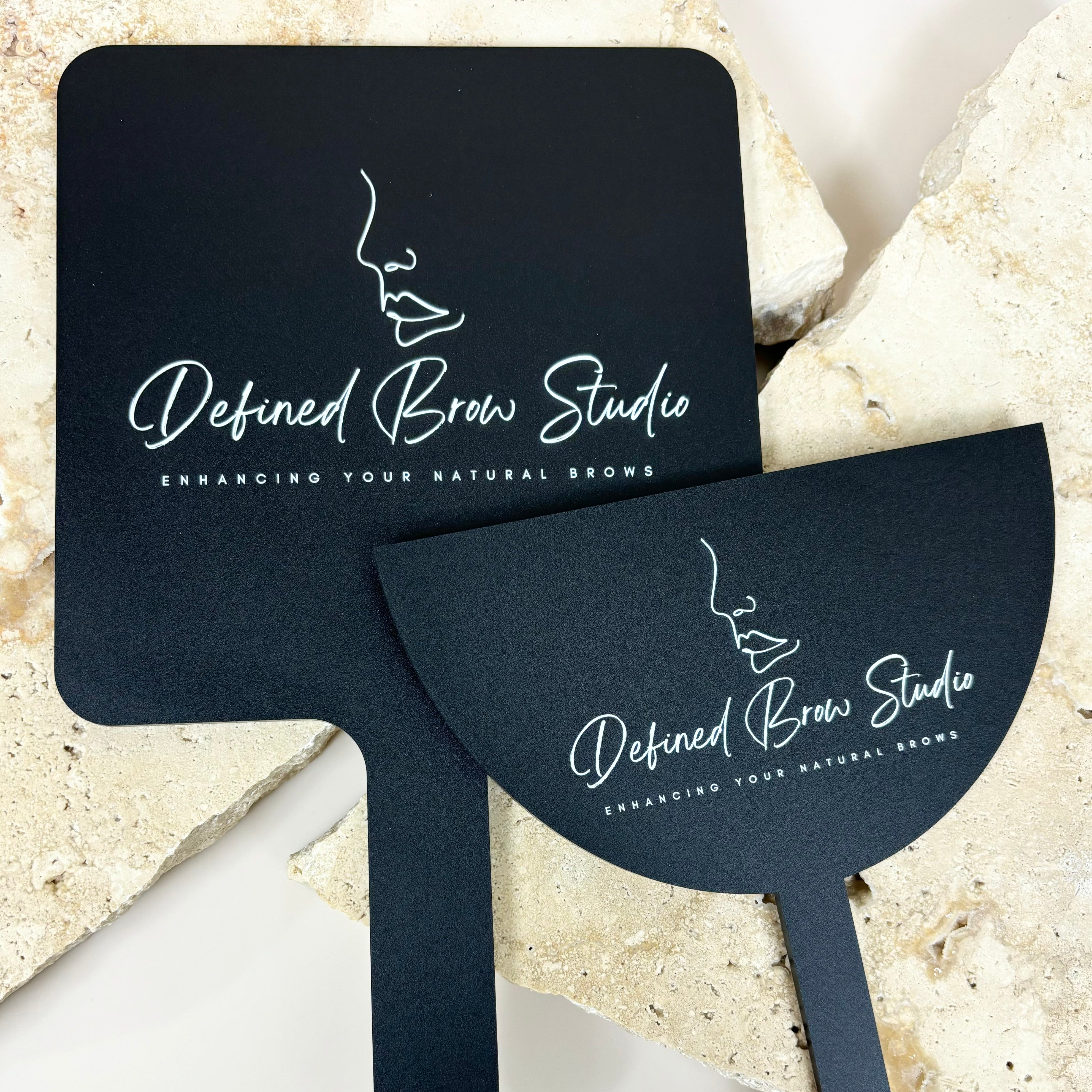 Black salon mirror and face shield bundle with white Defined Brow Studio logo for lash and brow professionals