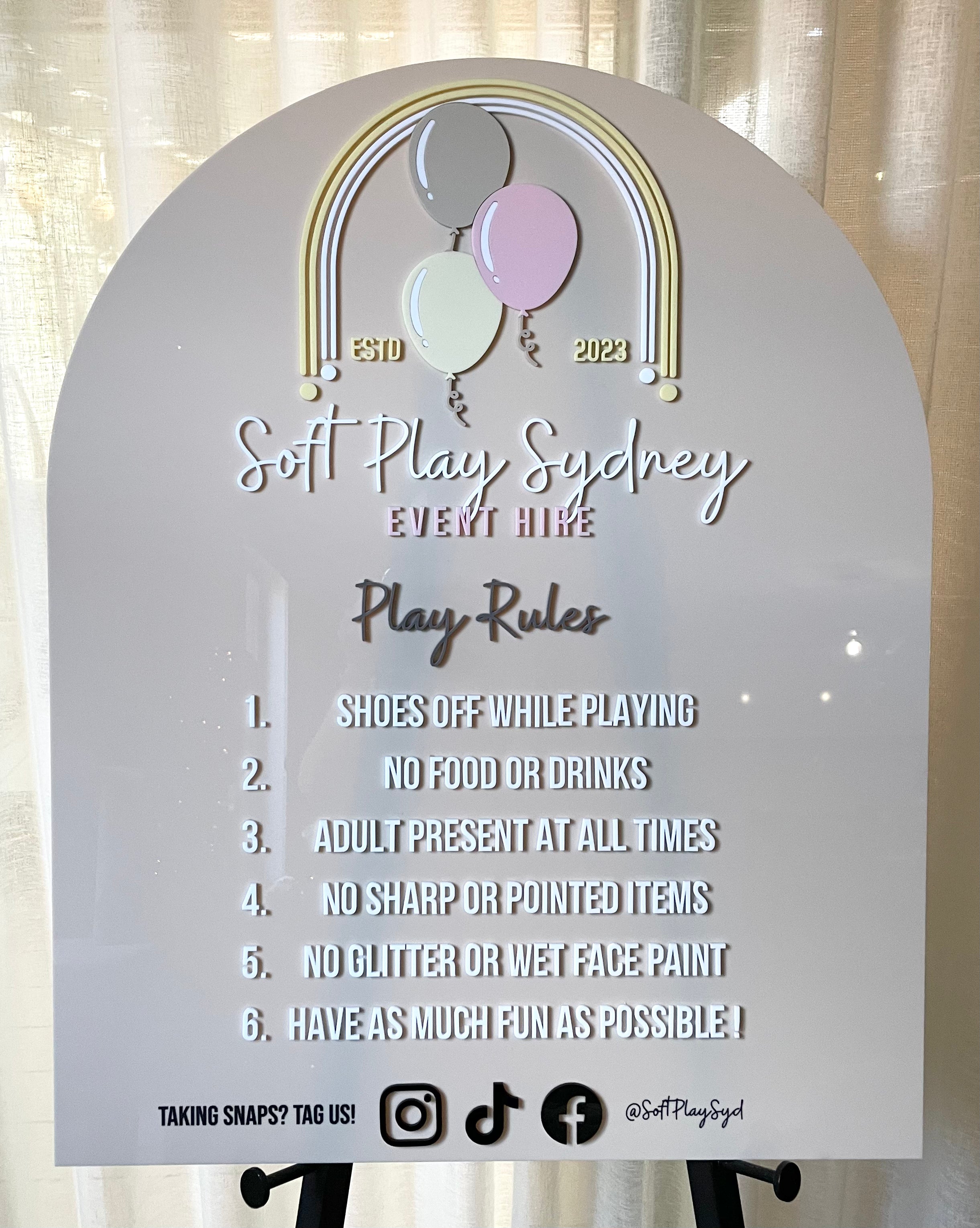 Beige acrylic arch sign for soft play rules