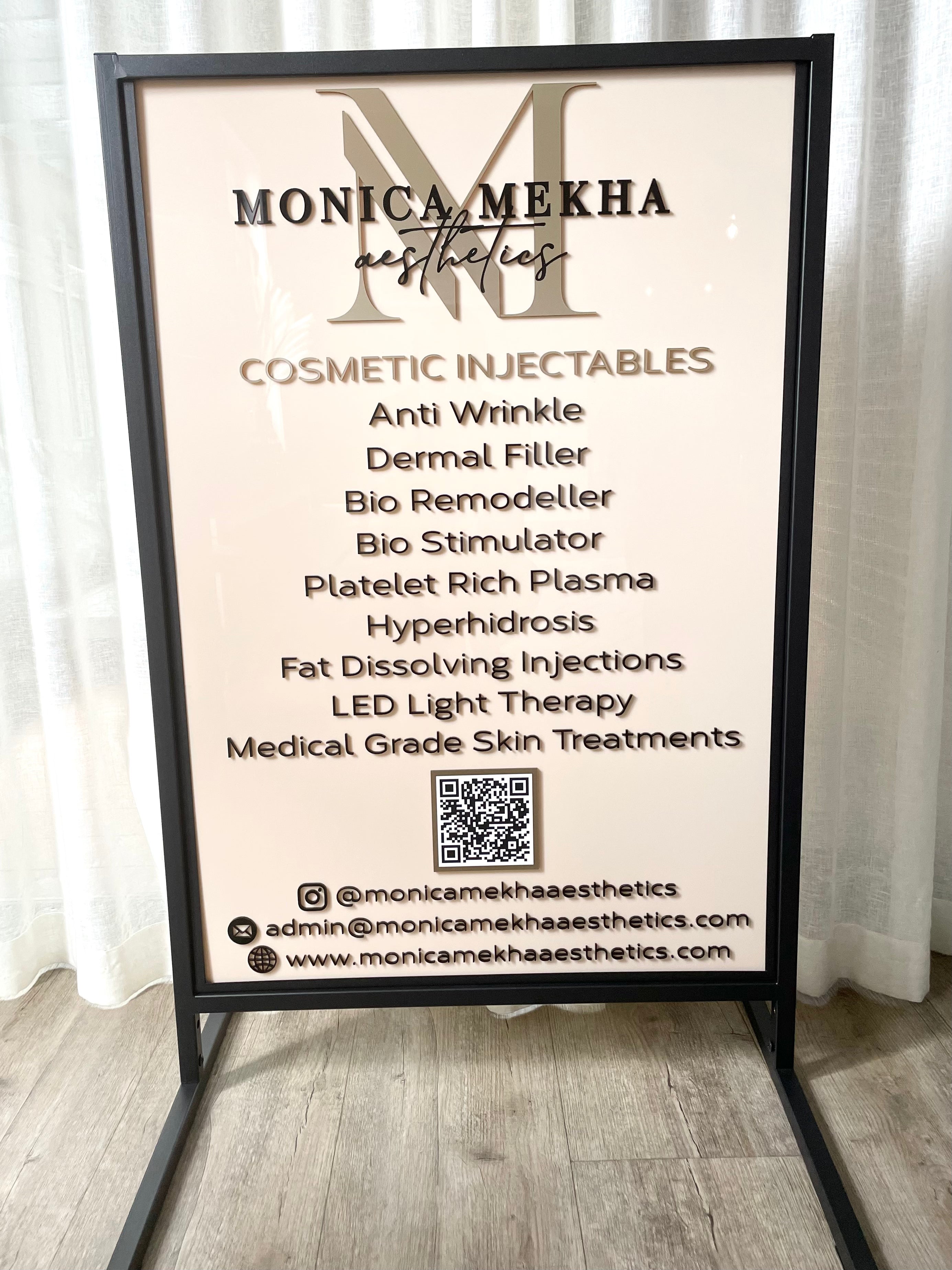 Beige pavement board with logo and salon menu