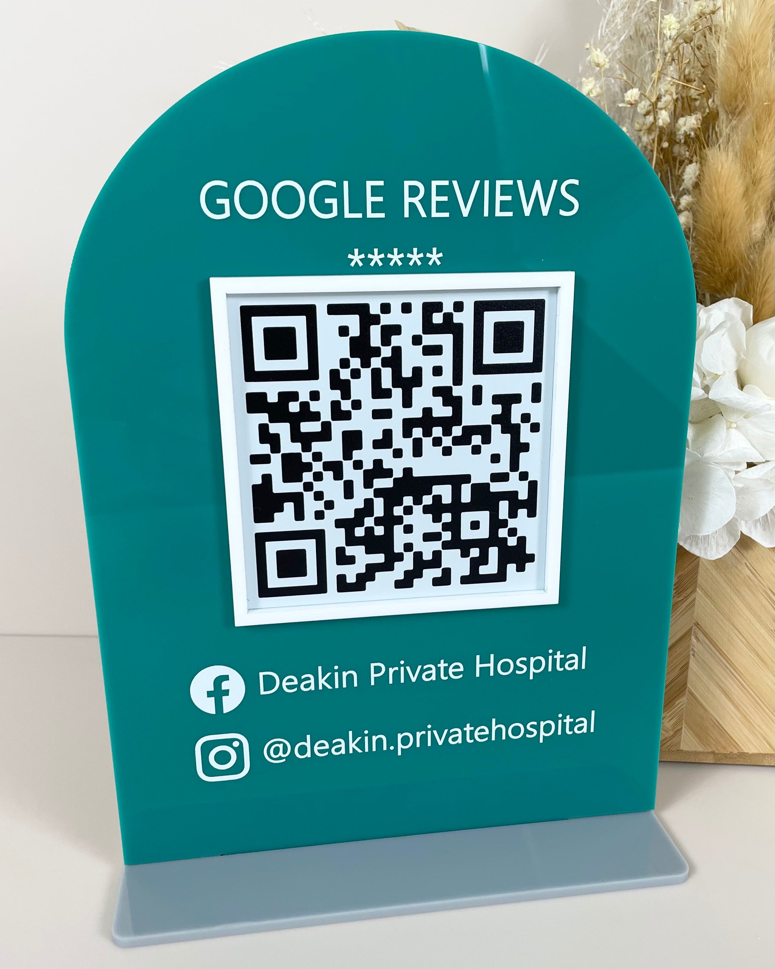 Teal Google review display sign with QR code for reception counters