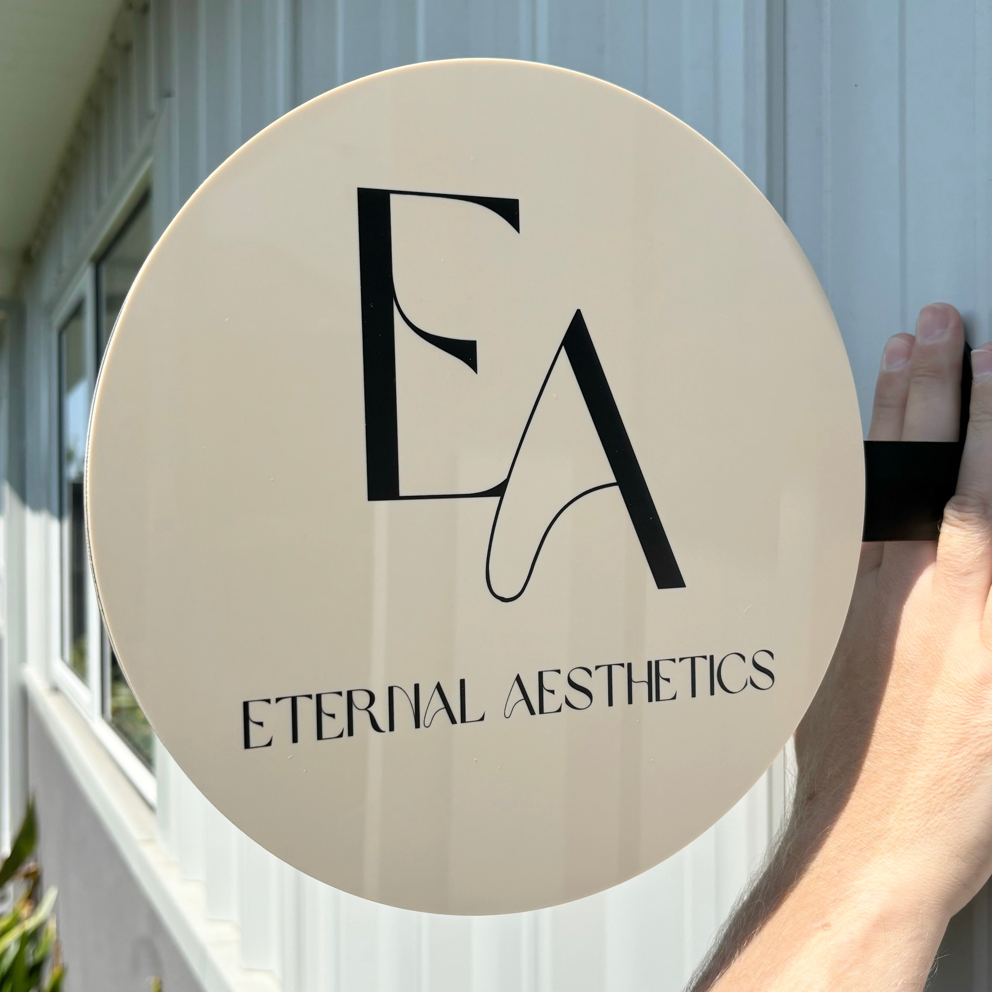 Elegant round salon blade sign for Eternal Aesthetics