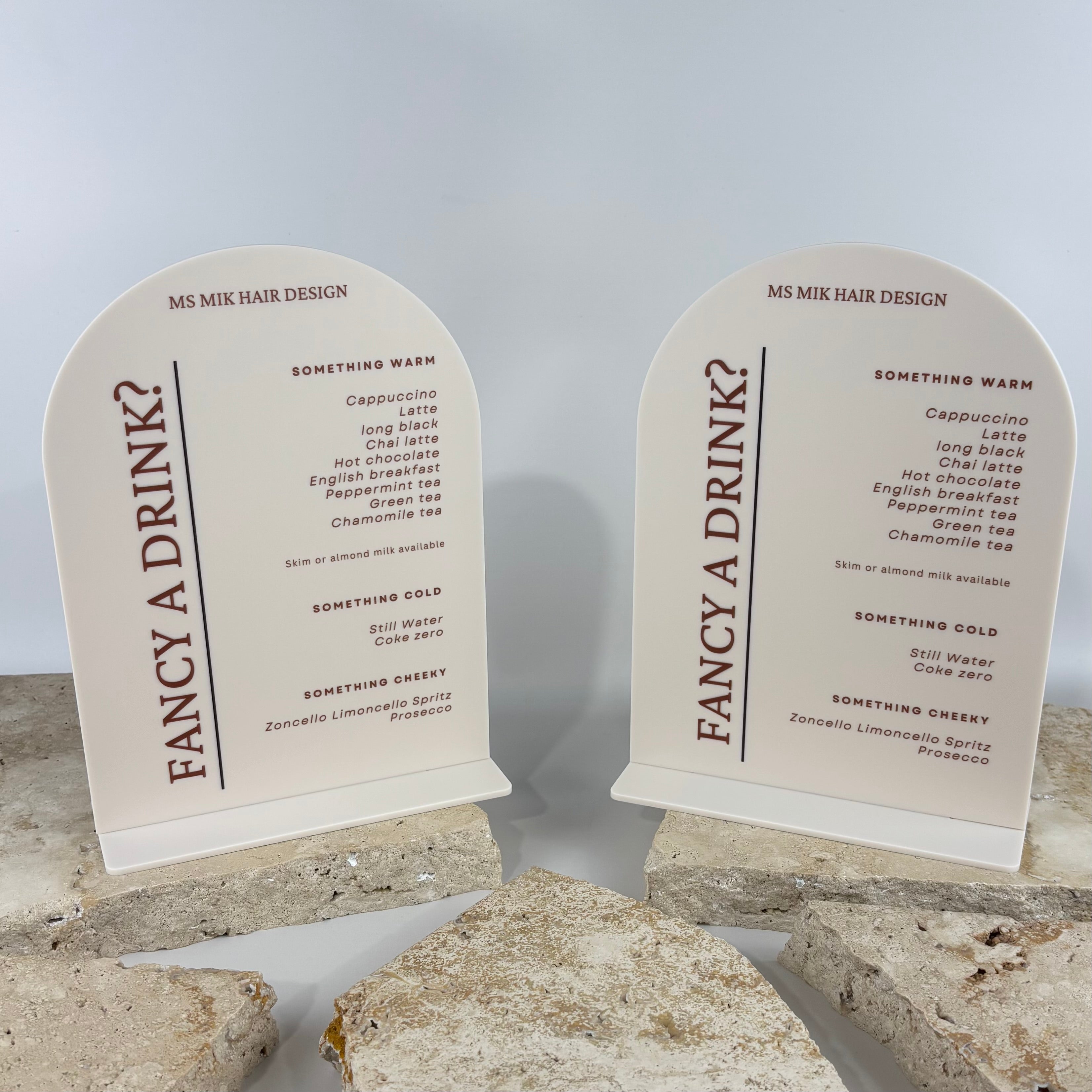 Custom cream acrylic arched drinks menu signs with UV printed brown text, “Fancy a Drink?” salon menu boards, freestanding countertop signage for hair salons, beauty clinics and cafes, modern reusable business display Australia.