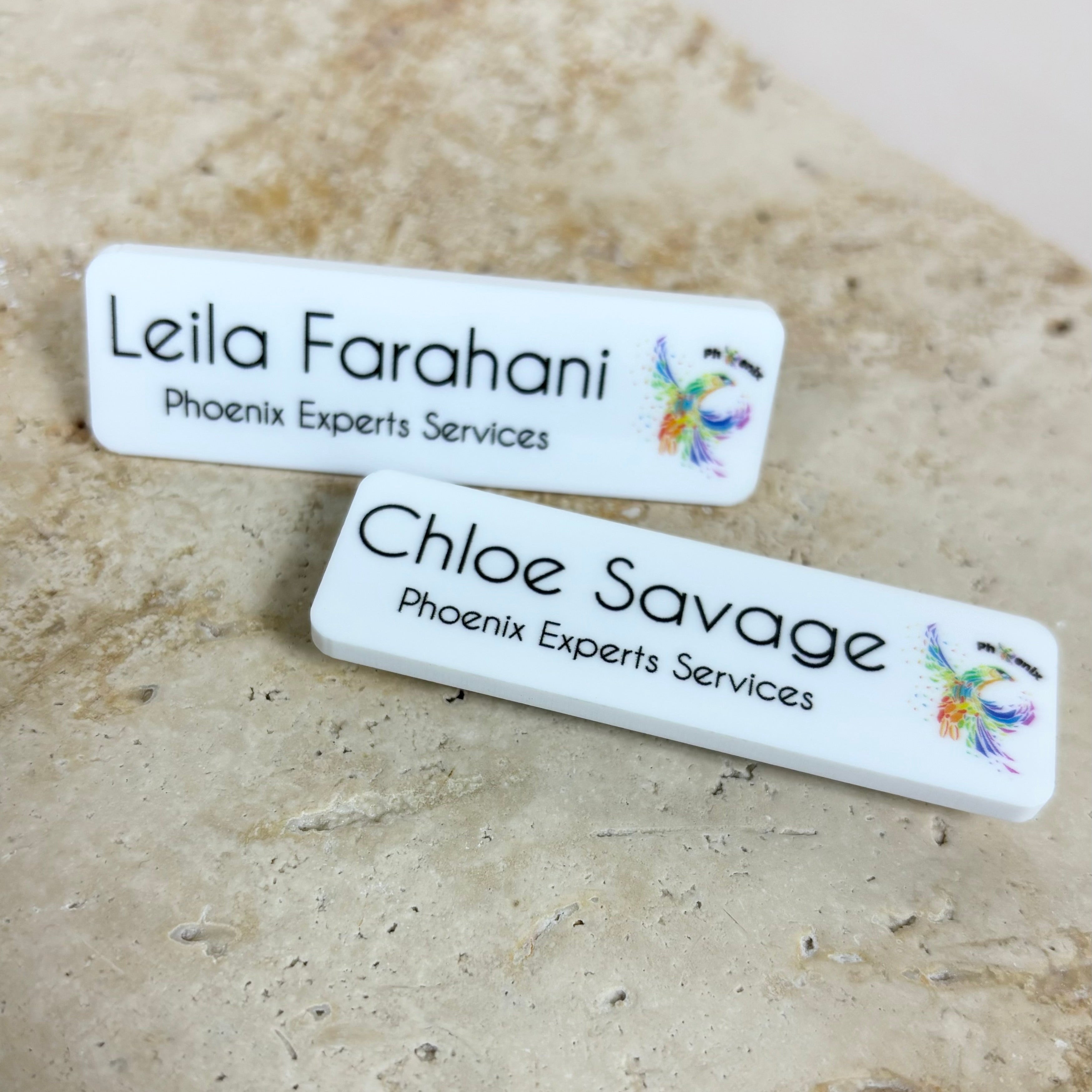Medical and dental staff name badges with clinic logos