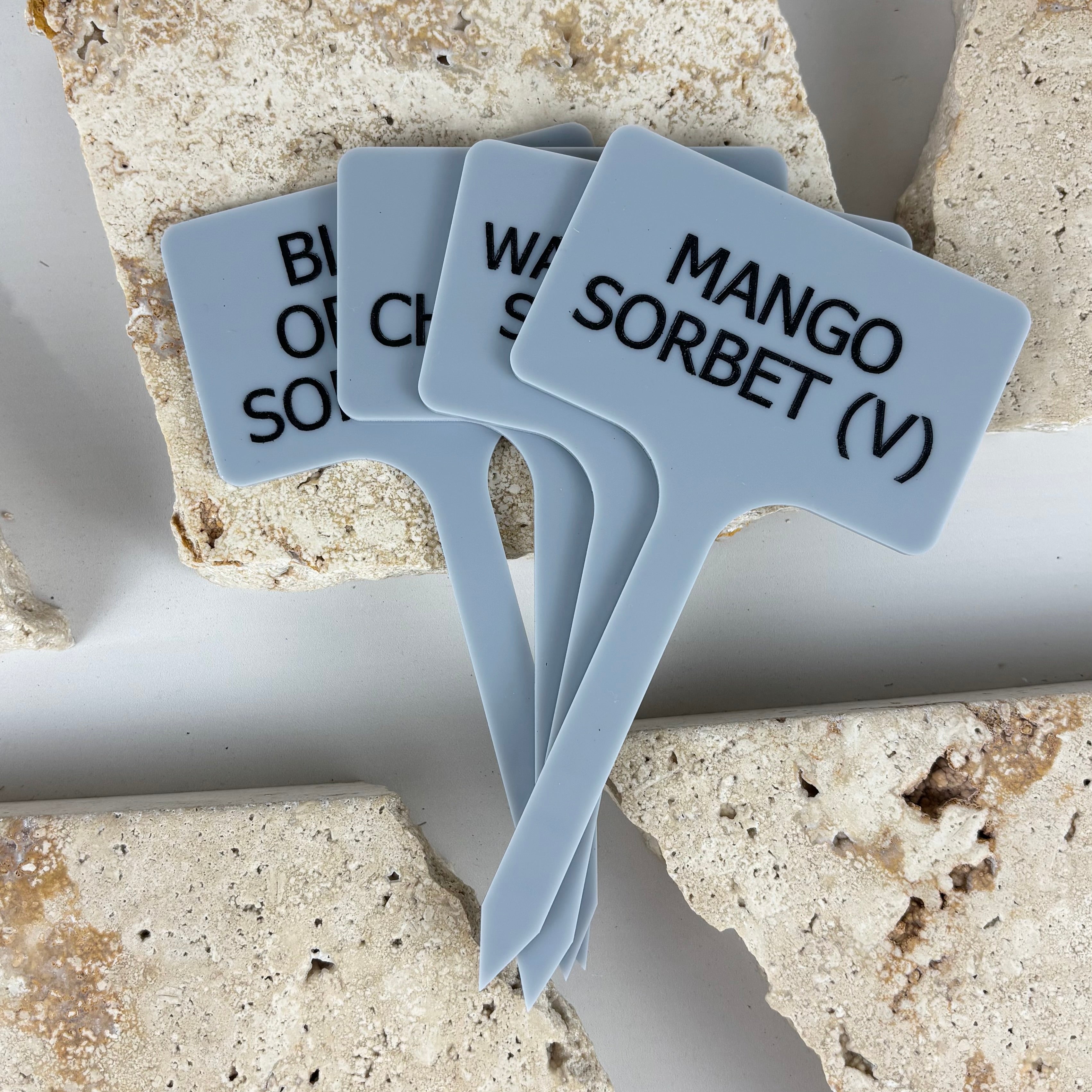 Custom acrylic ice cream flavour paddles with raised black lettering