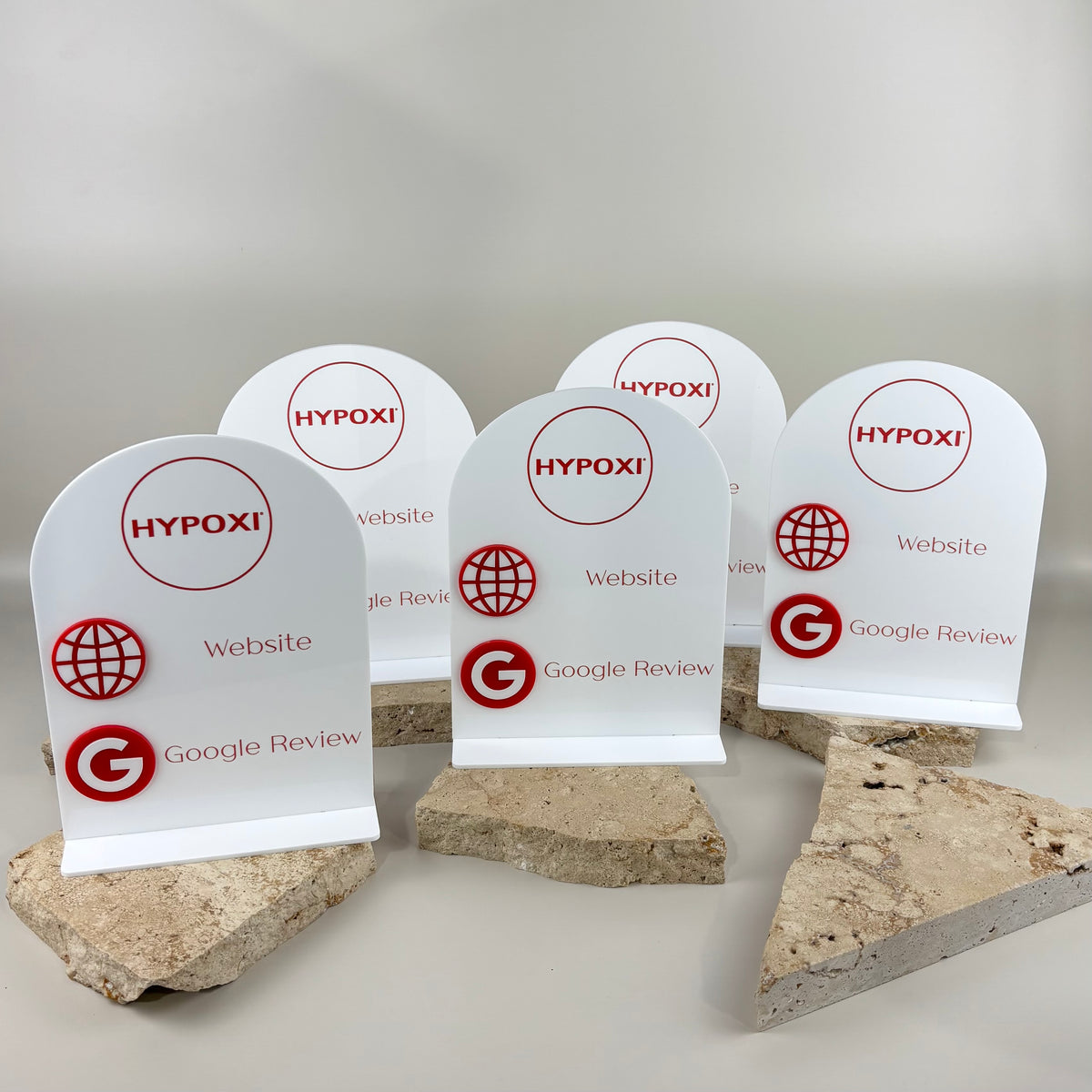 Custom white acrylic Google review and website stands with HYPOXI branding, red UV print and raised 3D acrylic icons.