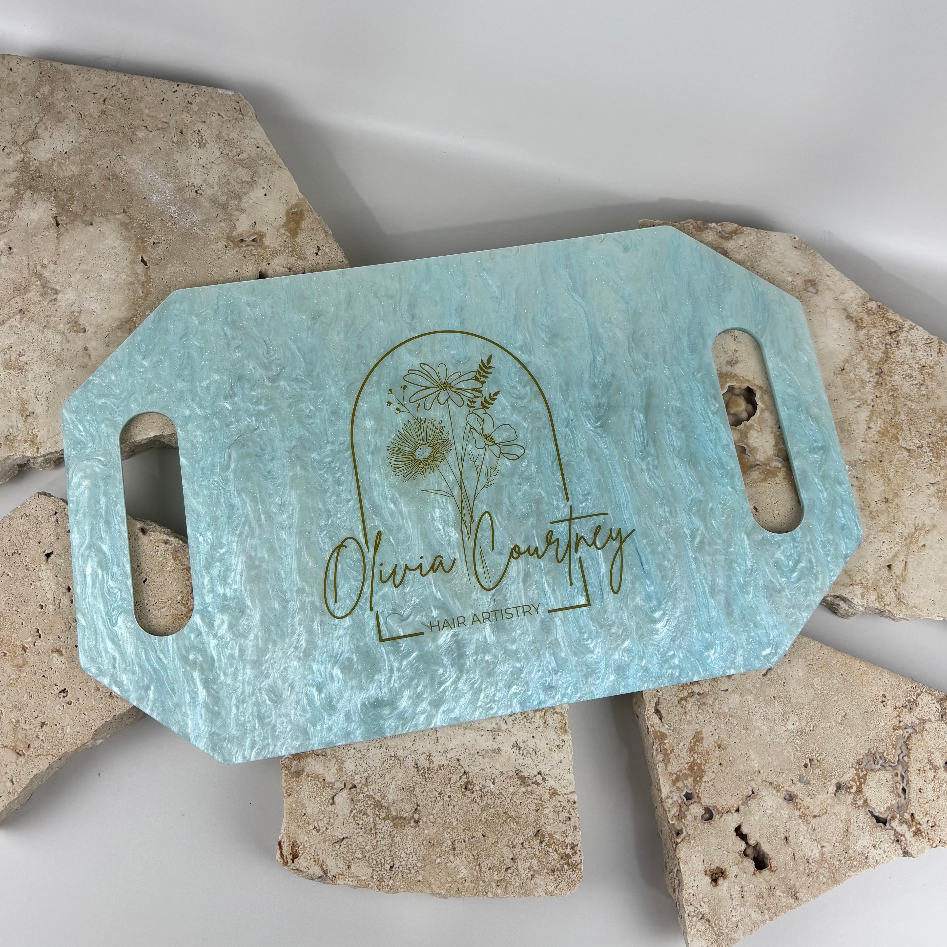 Personalised hairdressing mirror with pearl aqua acrylic finish and gold engraved logo, custom salon handheld mirror with cut-out handles, branded hair stylist mirror for client reveals, luxury acrylic salon accessory Australia-made