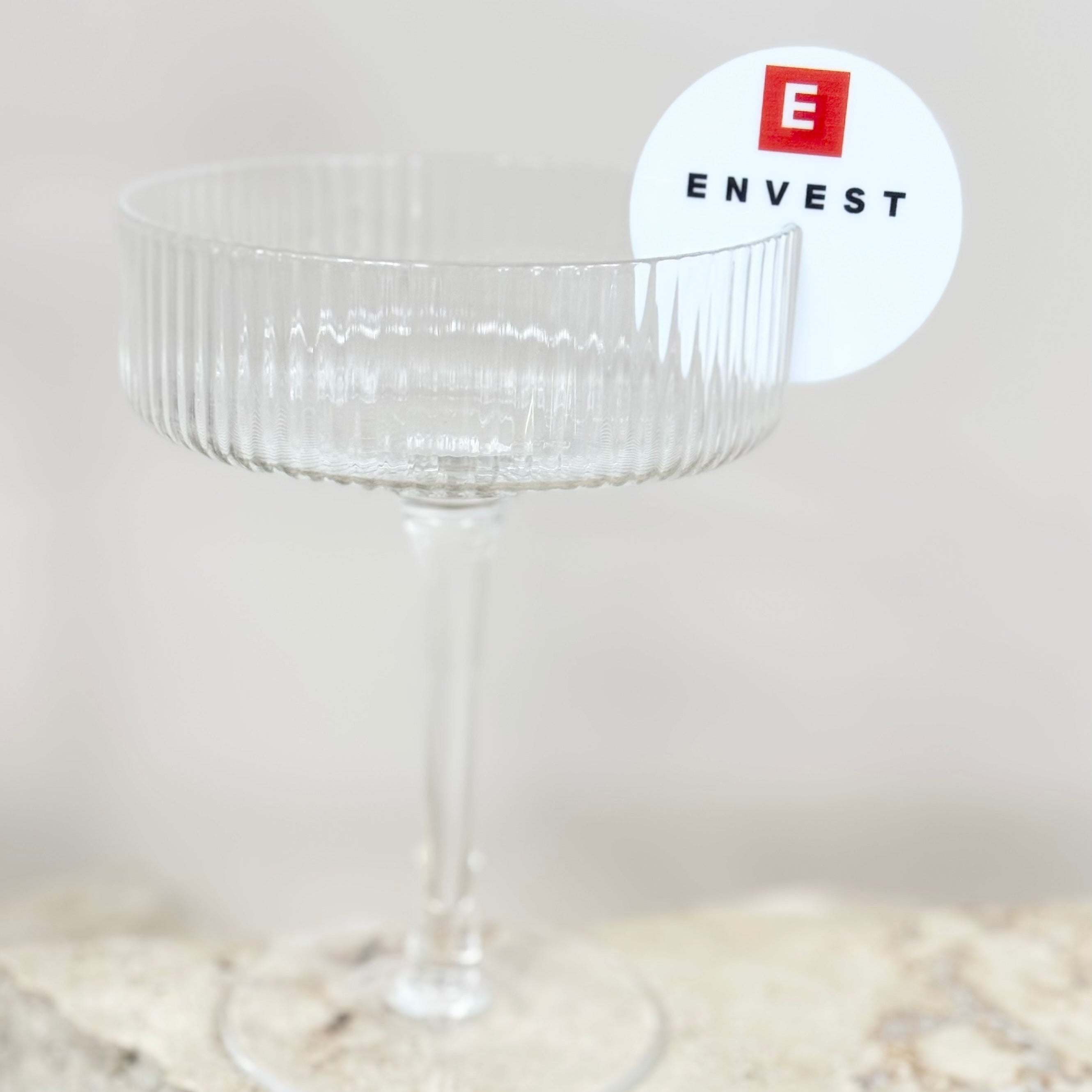 Black and white corporate drink tags with logo on glassware