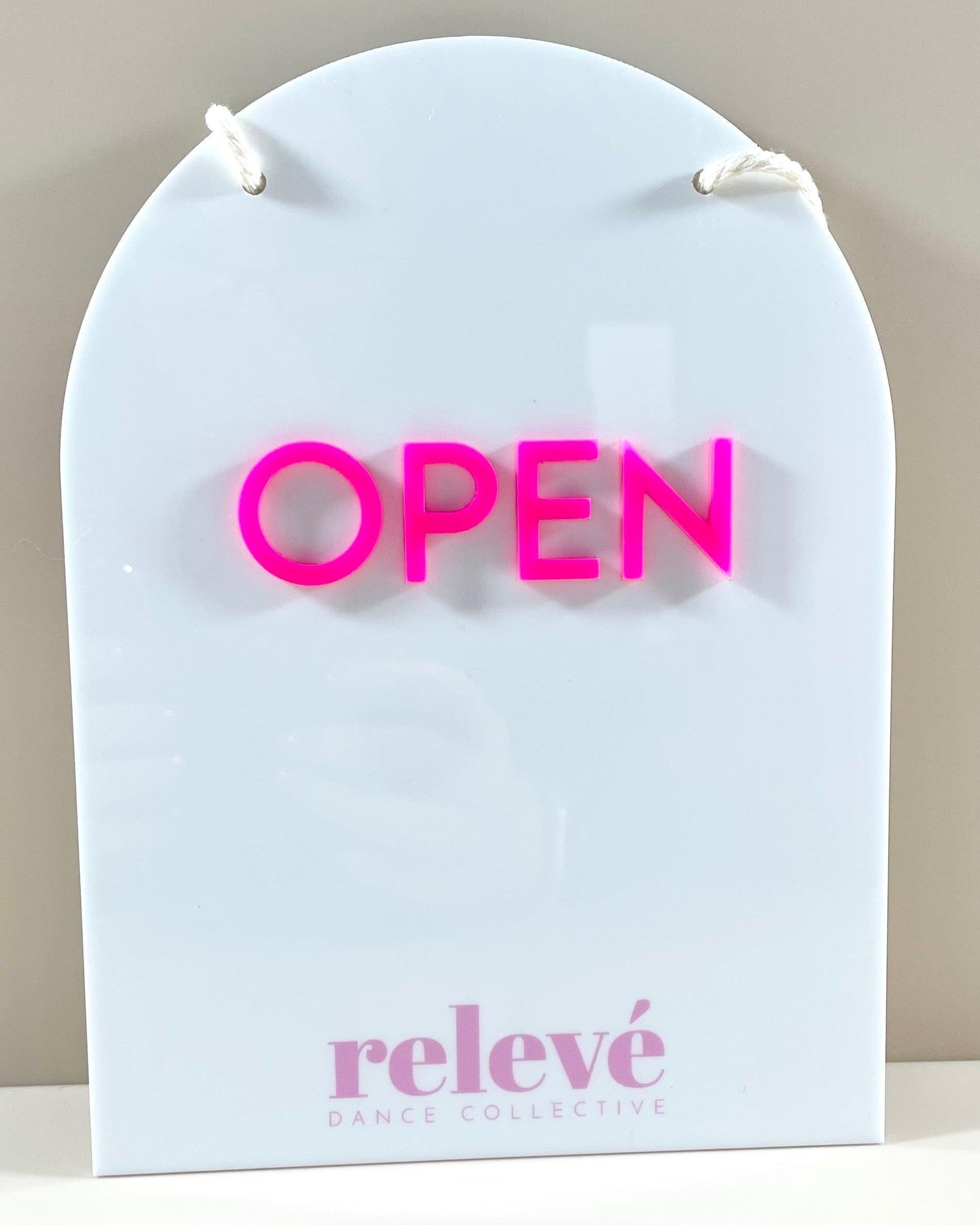 Arched white acrylic open sign with bright pink raised letters – salon and retail sign