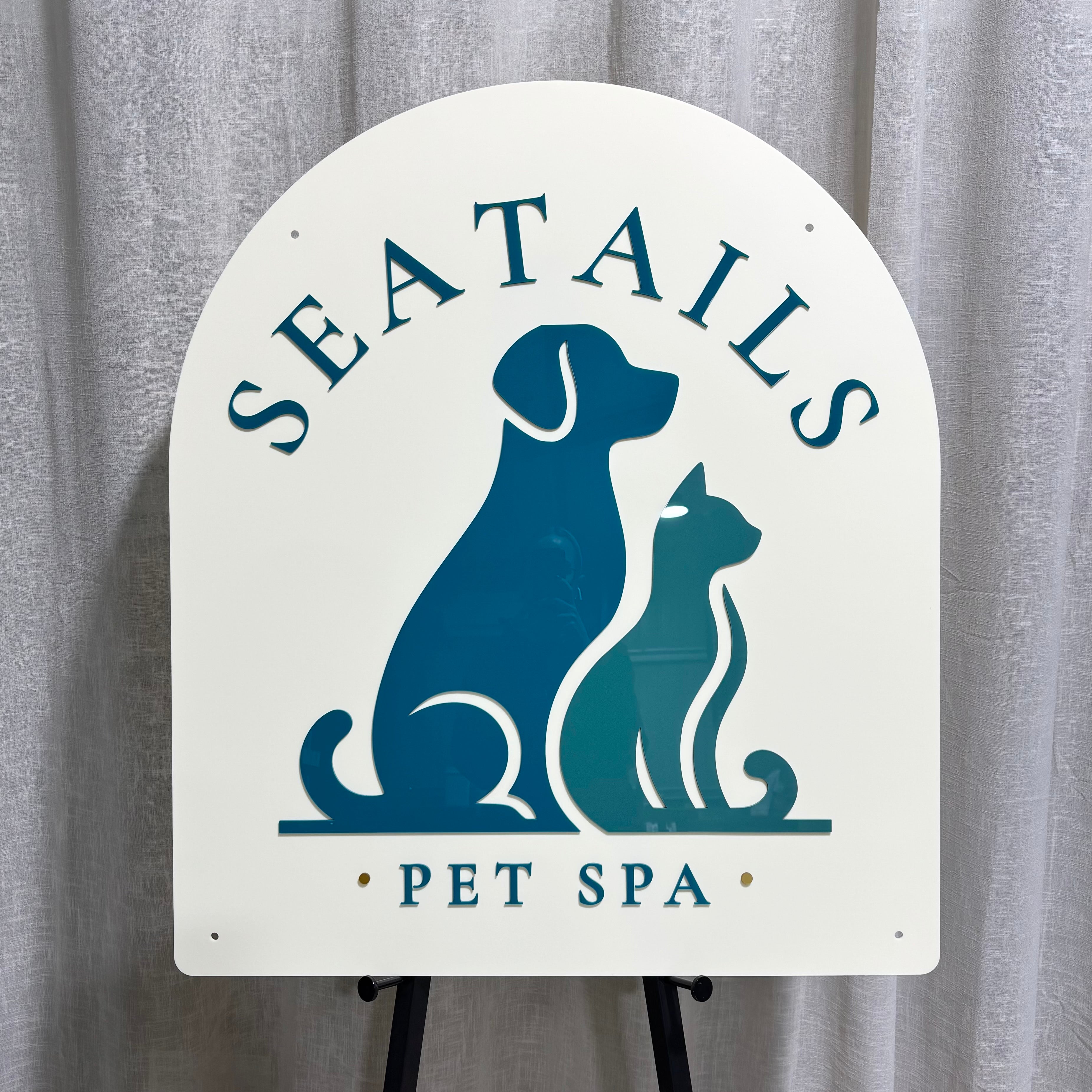 Custom arched acrylic pet grooming salon sign featuring 3D layered lettering and dog and cat logo. Premium business signage for pet spas, dog groomers, cat grooming salons, veterinary clinics and pet care businesses, designed with raised acrylic elements for a professional and eye-catching storefront display.