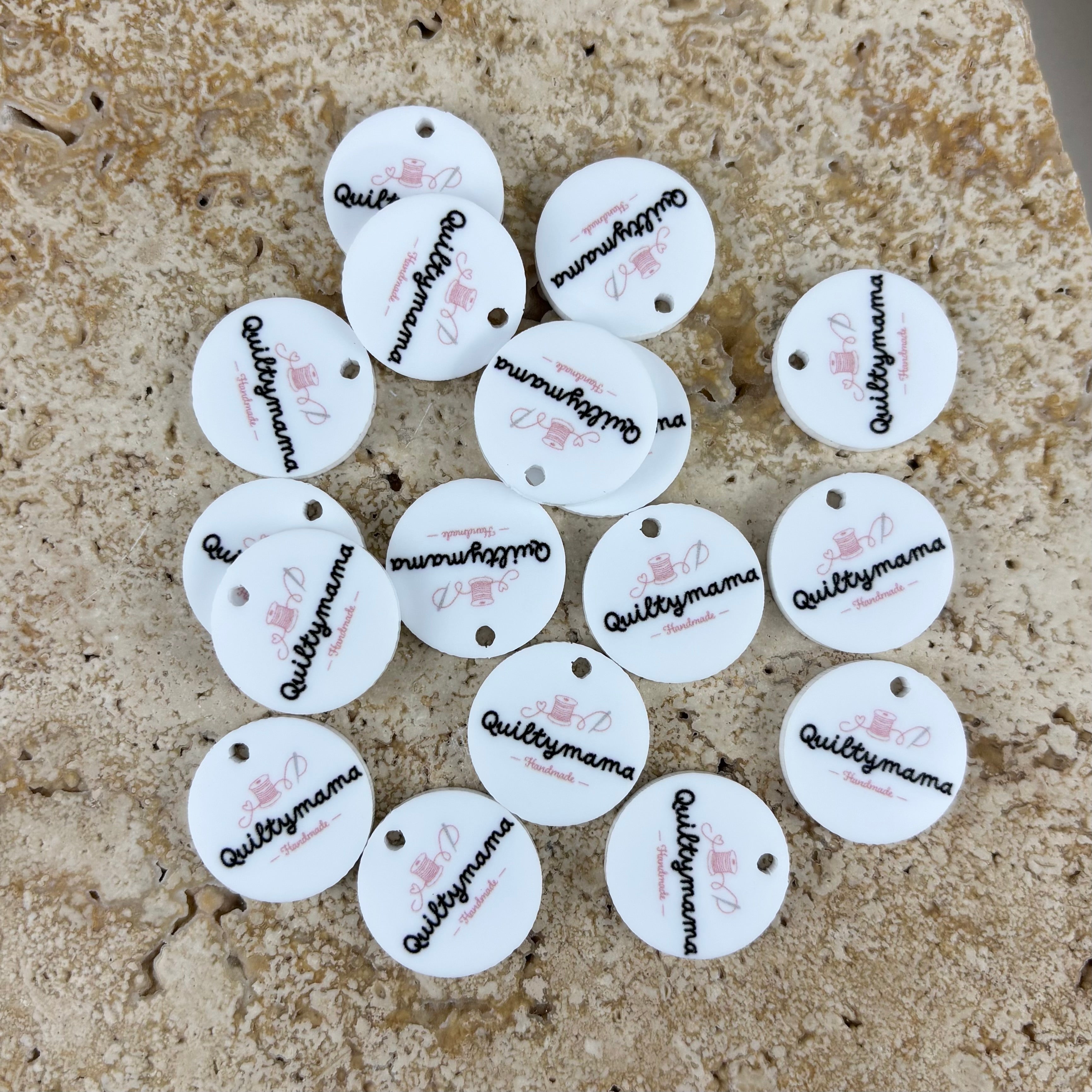 Custom acrylic product tags with UV printed business logo for handmade products, personalised round swing tags for small business packaging, sewing labels, crochet tags, clothing tags and craft branding in Australia and New Zealand.