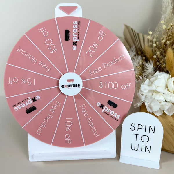 Spin-to-win wheel with Express Hair salon branding on a neutral background