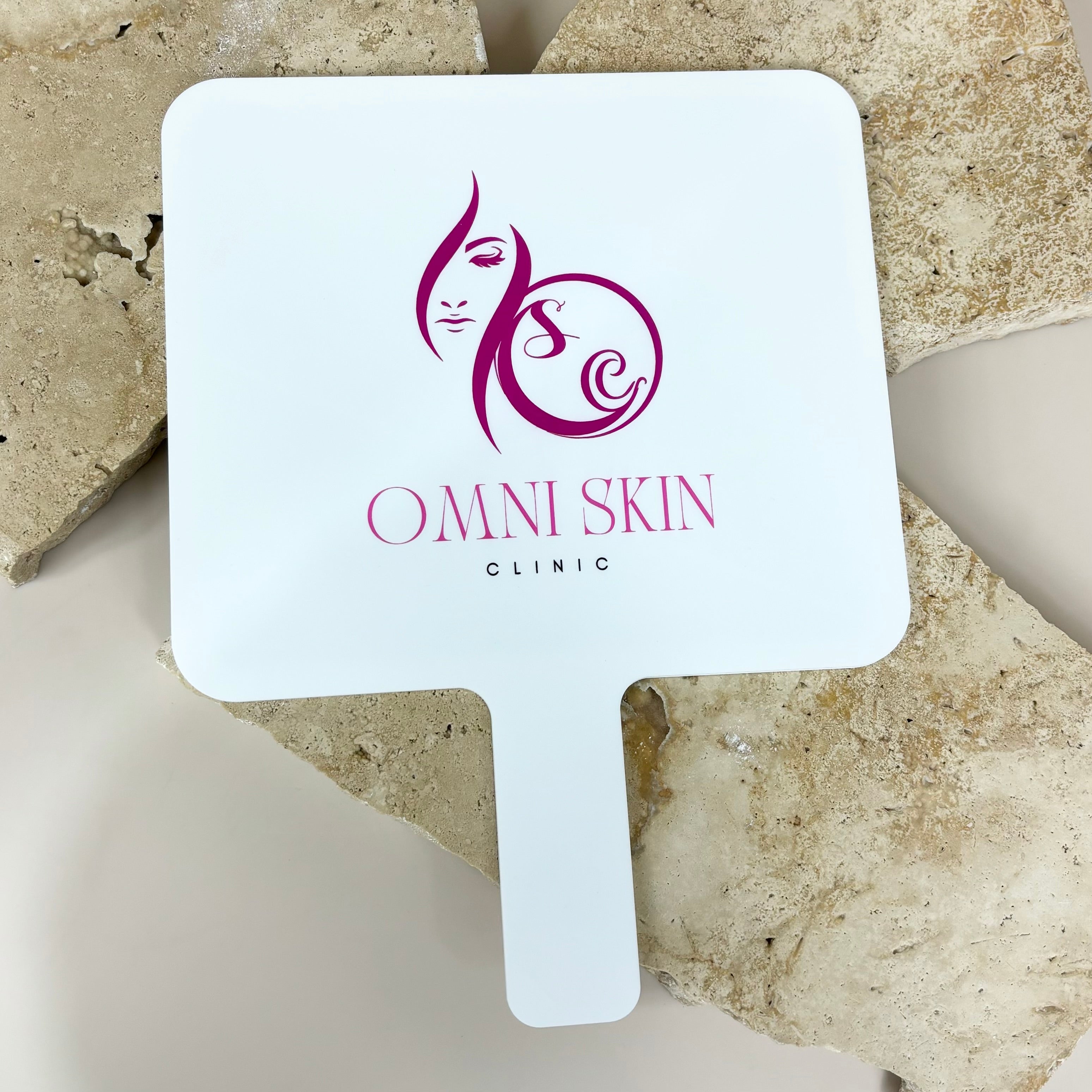 Custom mirror with Omni Skin clinic logo