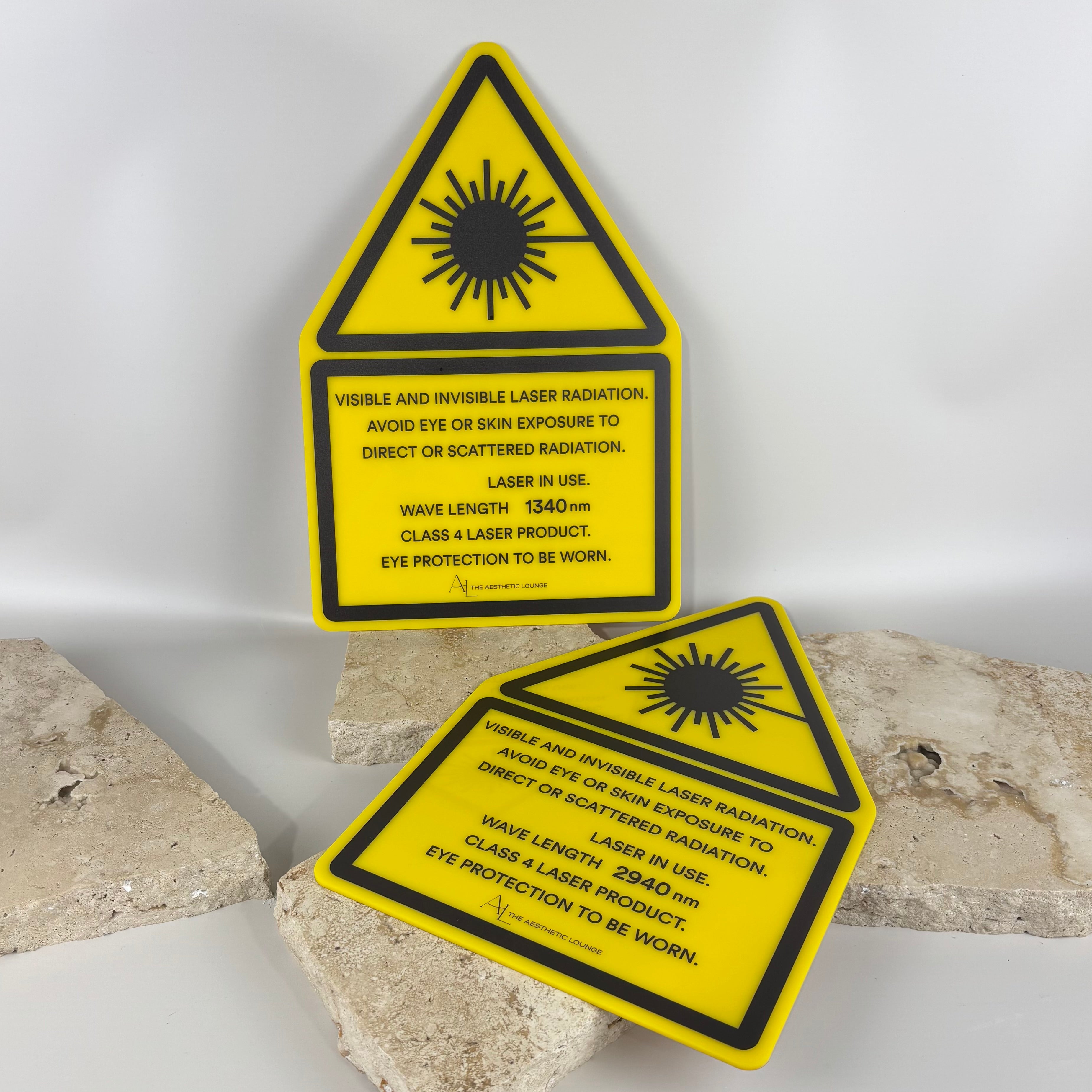 Yellow acrylic laser warning signs with radiation hazard symbol and safety text for clinics and workplaces