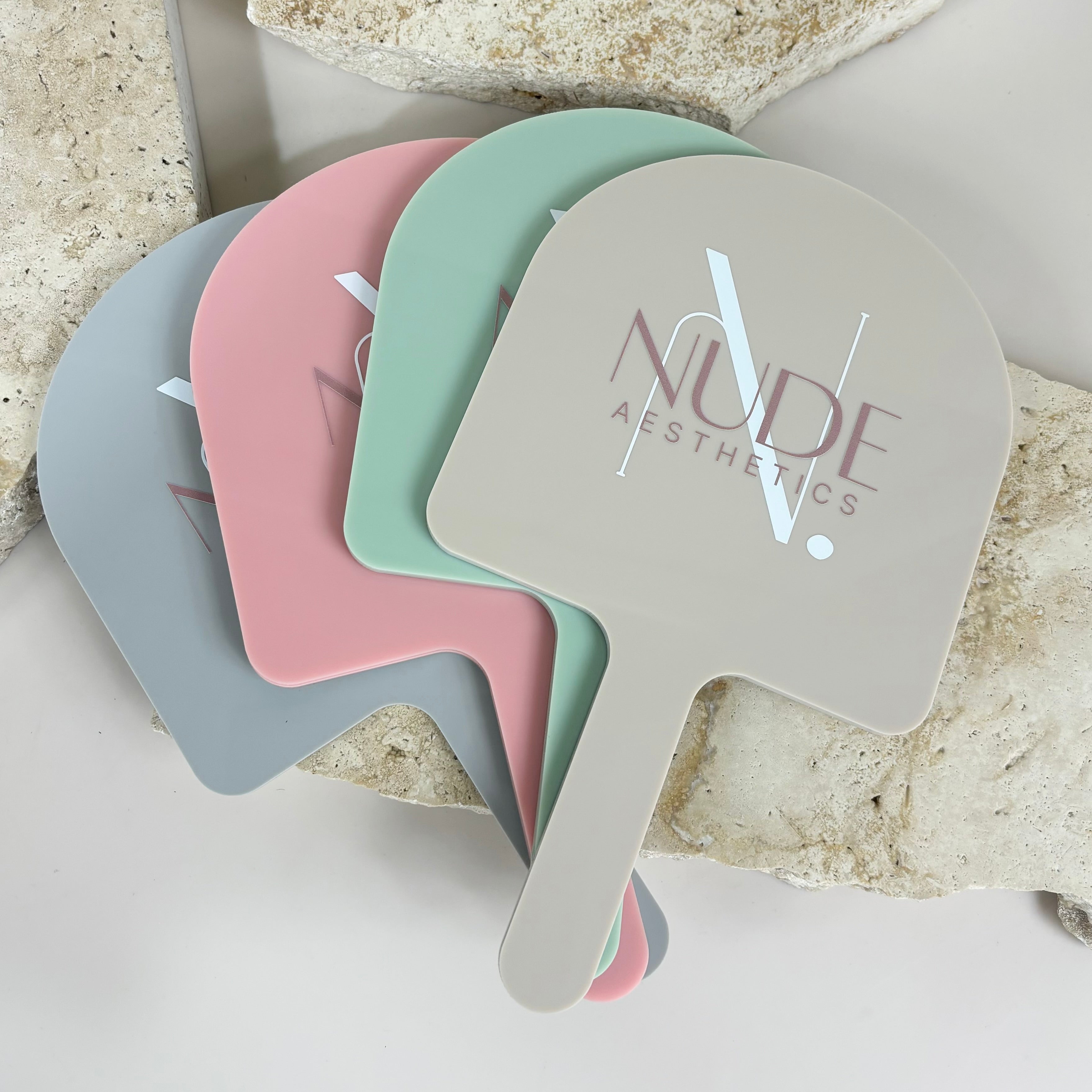 Set of pastel arched handheld mirrors for beauty businesses