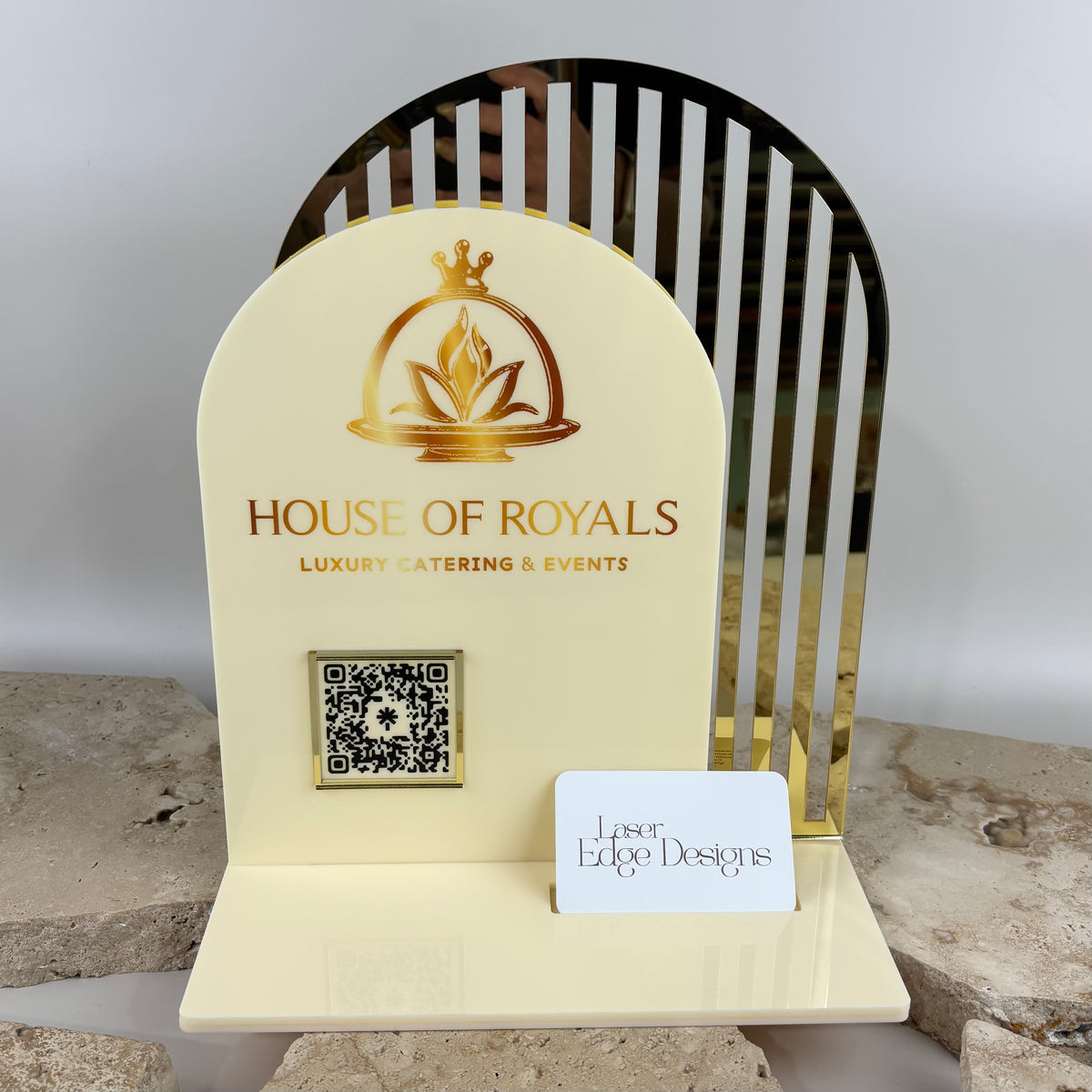 Custom cream acrylic business display for House of Royals luxury catering, featuring a gold mirror acrylic arch backing, printed business logo, QR code and integrated business card holder.