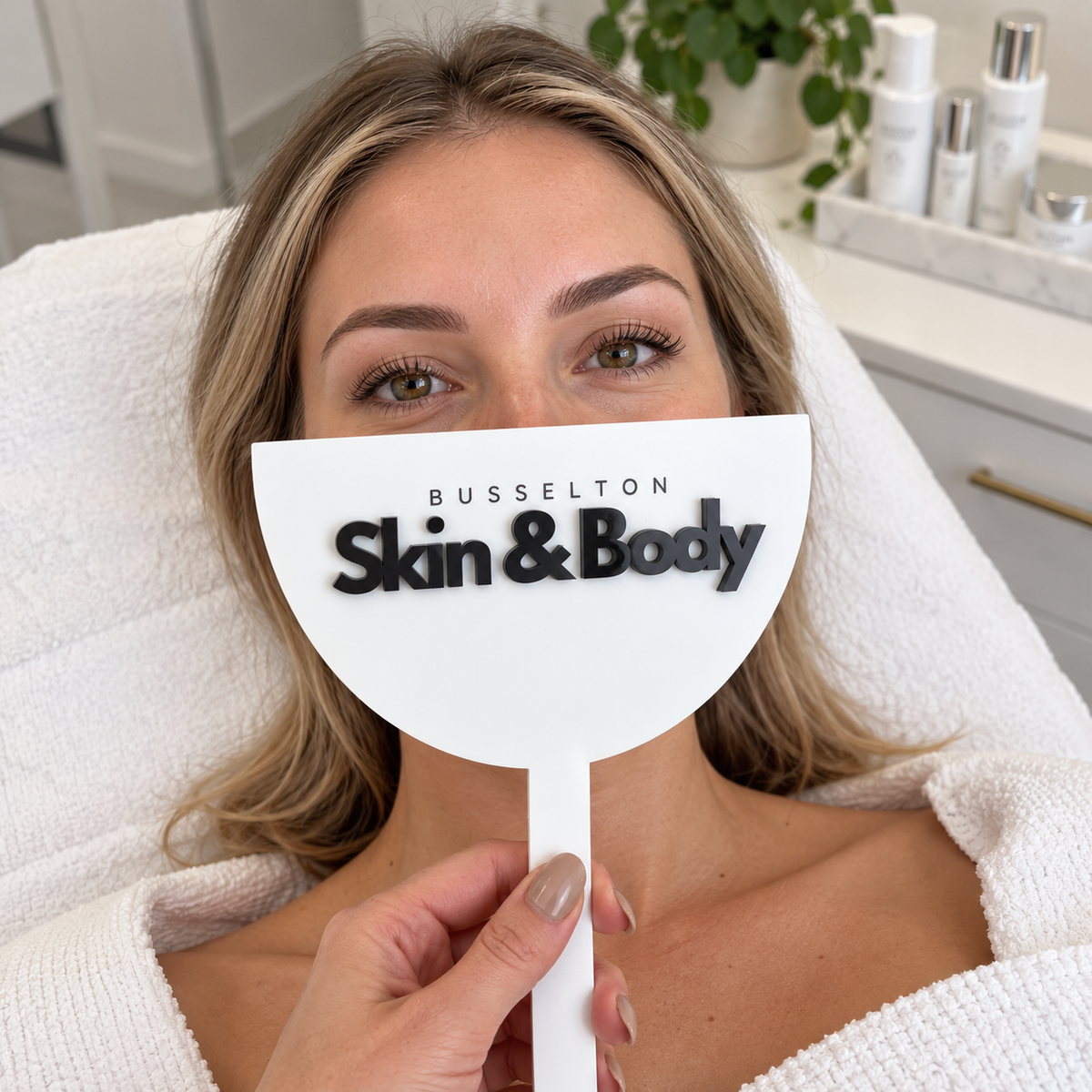 Custom branded photo shield for skin and beauty clinics, covering the client’s nose and mouth while keeping the eyes visible for treatment photos.
