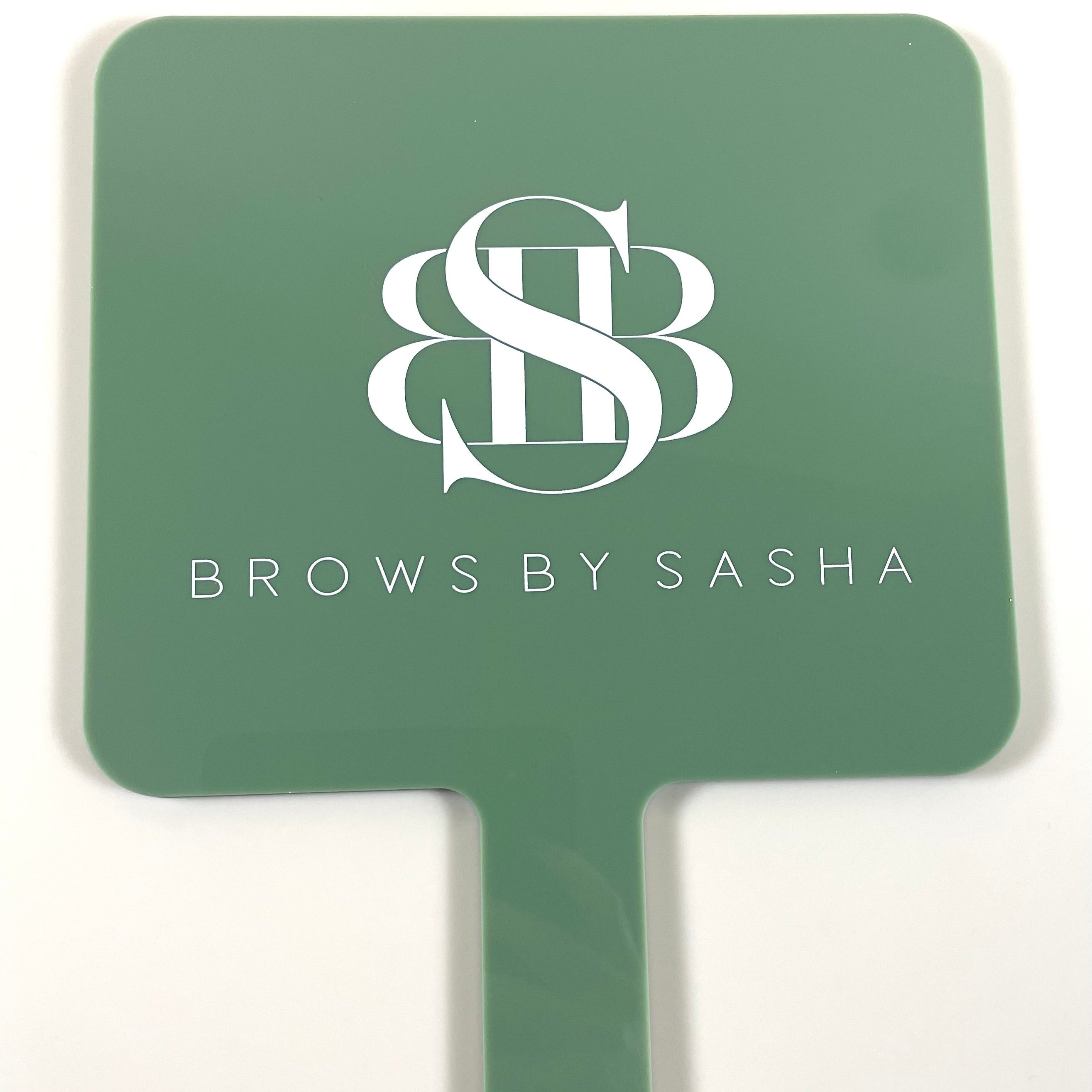 Brows by Sasha logo on green square handheld mirror