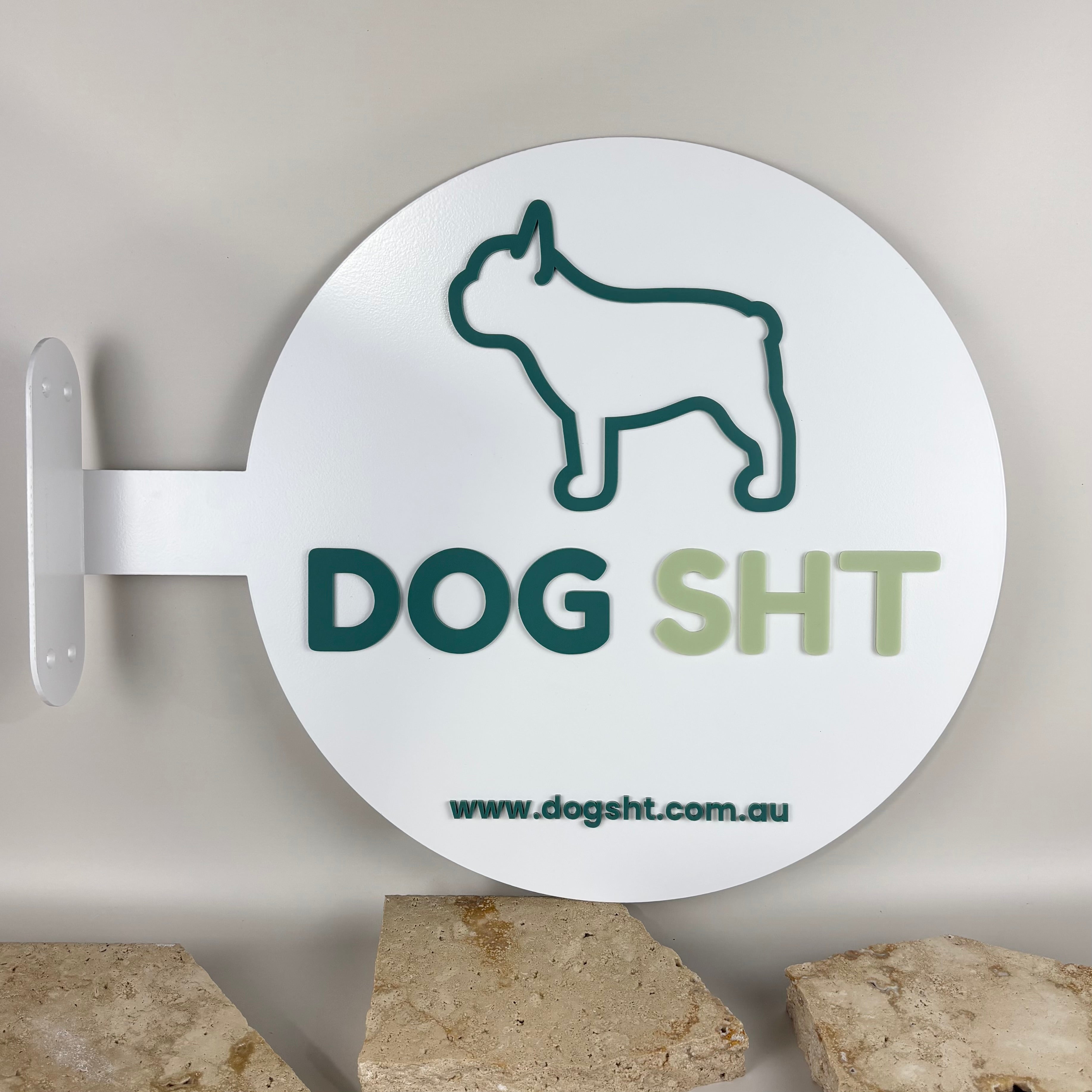 Custom round acrylic blade sign for DOG SHT featuring 3D raised lettering and French Bulldog outline, mounted on white backing with website URL www.dogsht.com.au – Australian made business signage by Laser Edge Designs.