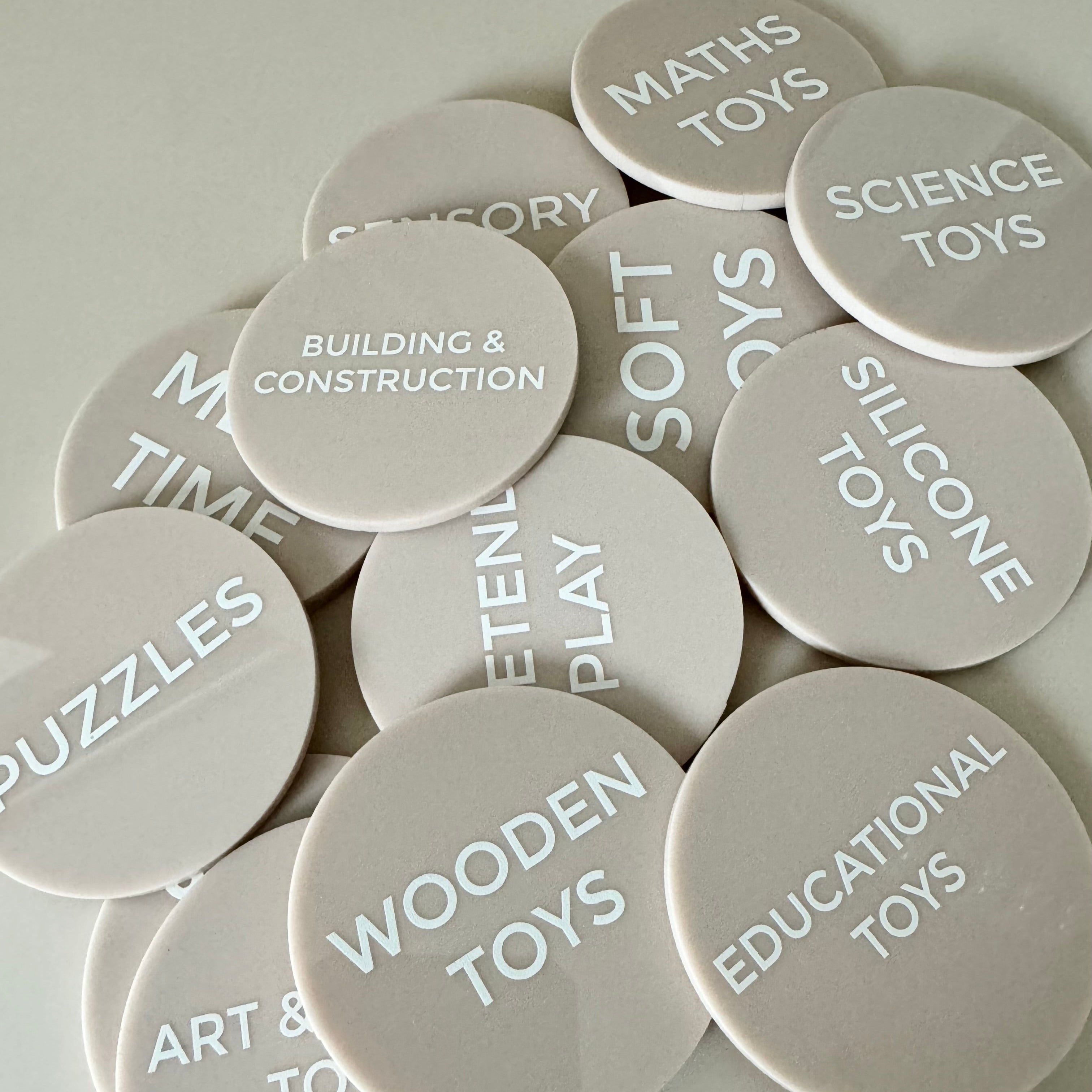 Matte acrylic price discs engraved with product names and clear pricing
