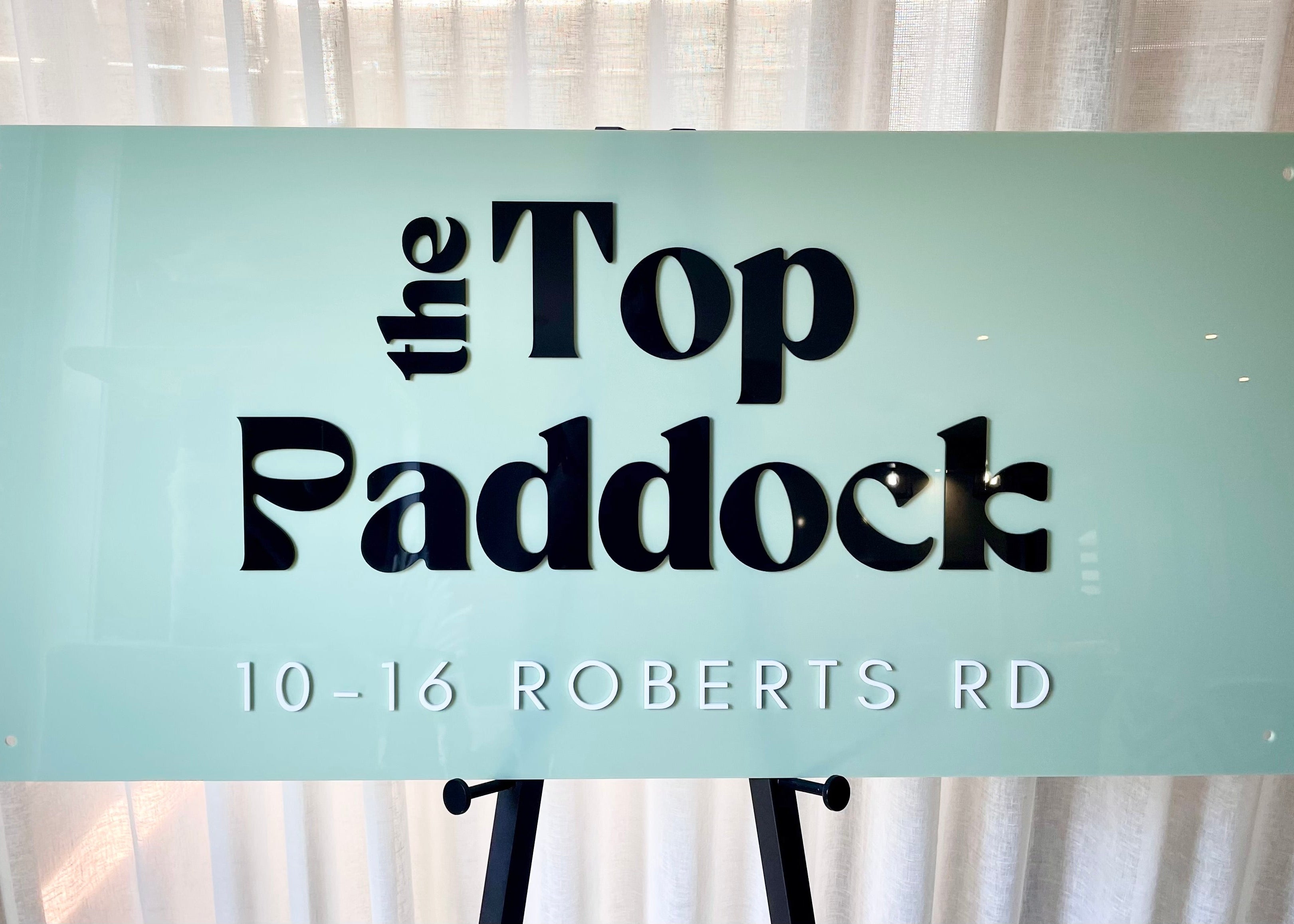 Business signage for The Top Paddock café