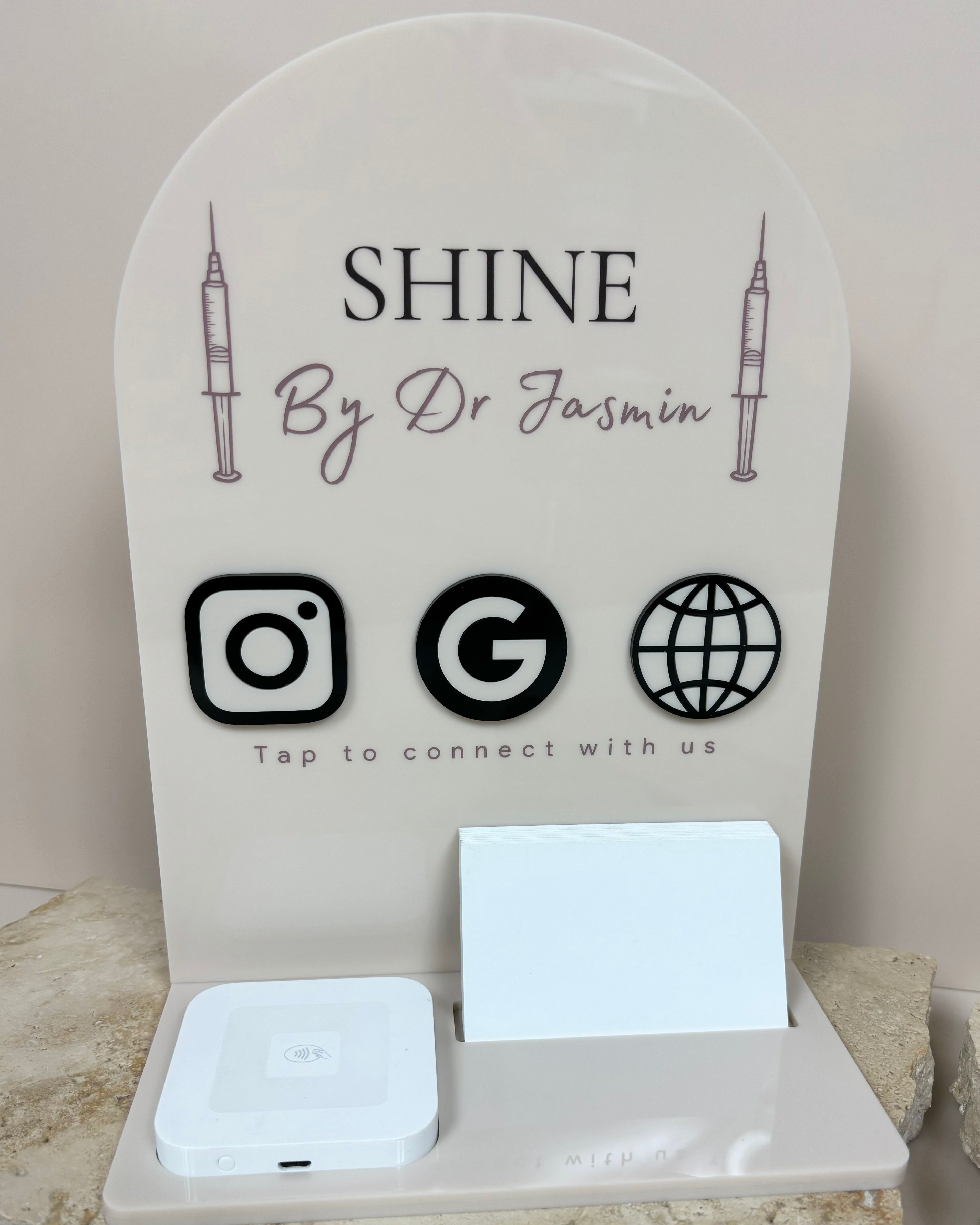 Custom acrylic NFC business station with square dock and card holder – Shine by Dr. Benjamin branding with social media icons.