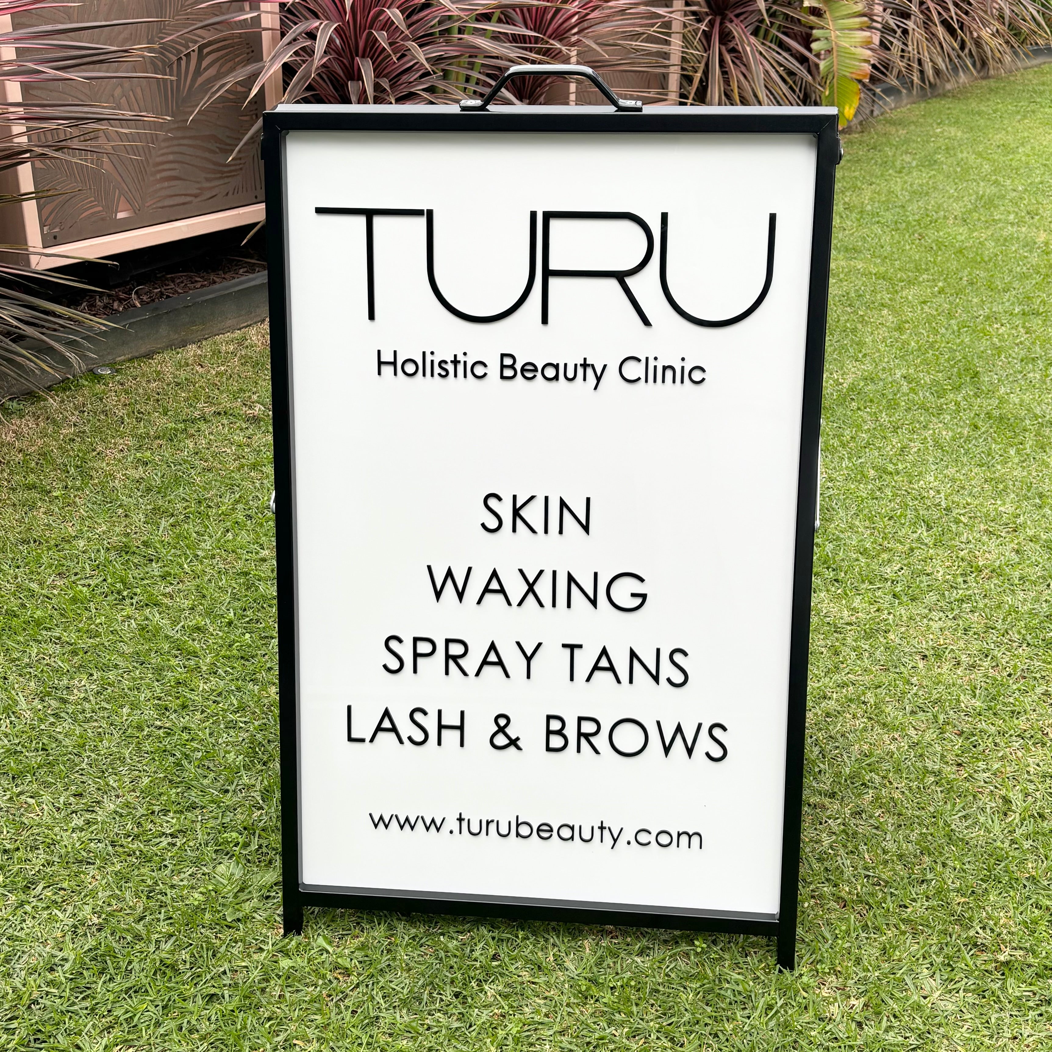 Custom outdoor portrait A frame sign with Turu Holistic Beauty Clinic logo
