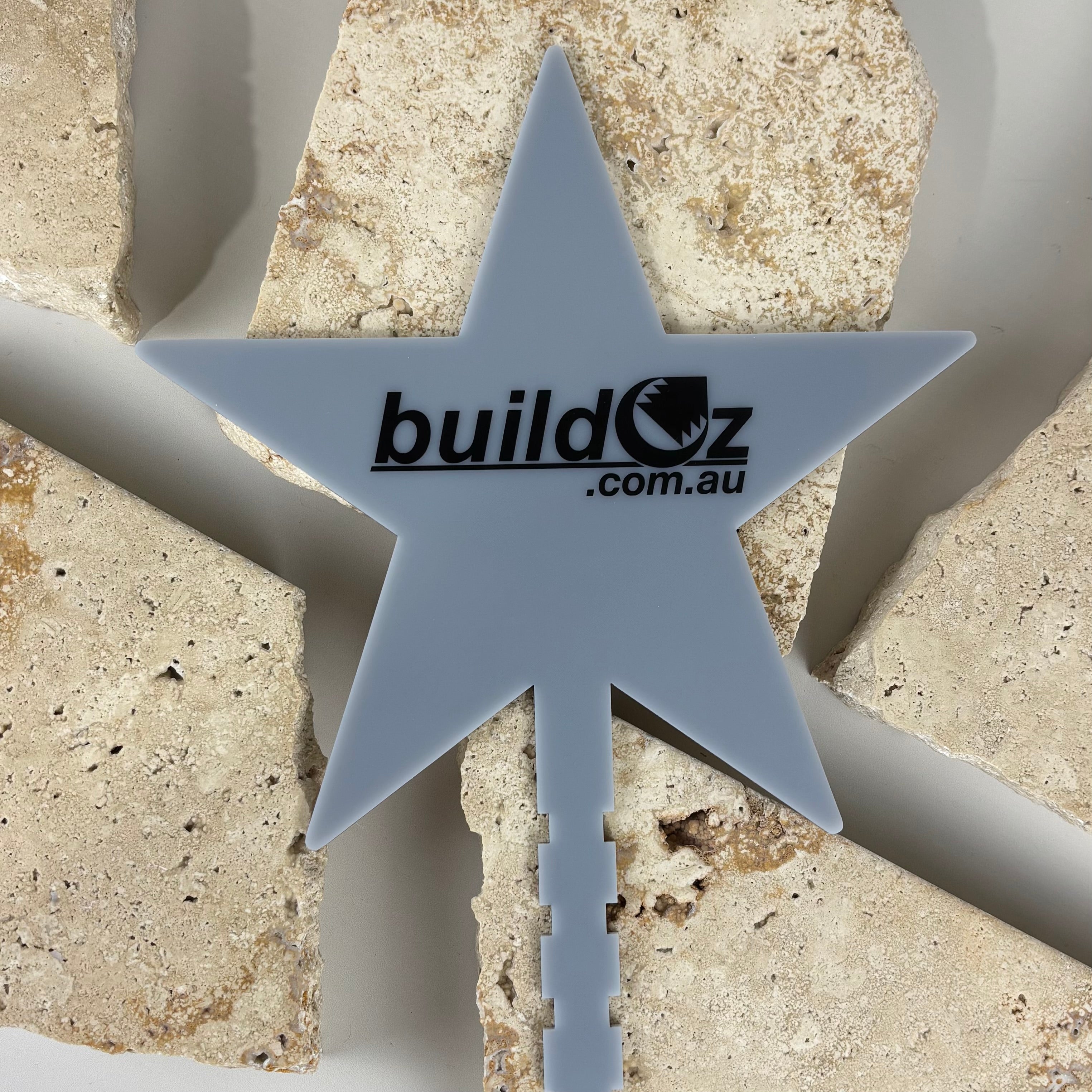 custom star shaped acrylic christmas tree topper in matte grey with buildoz.com.au logo printed on centre, personalised business branded holiday decor australia made