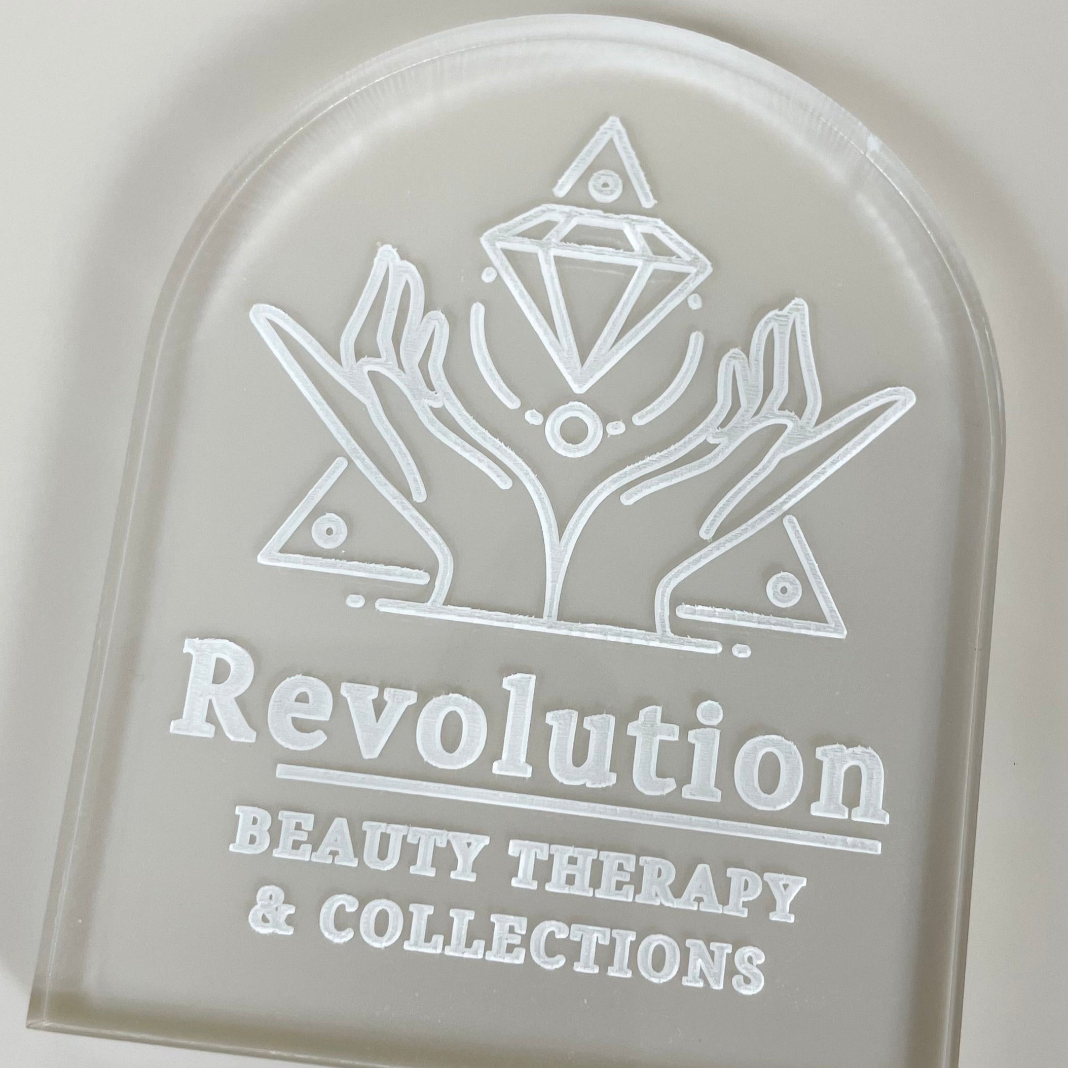 Revolution Beauty Therapy cookie stamp showing engraved business logo