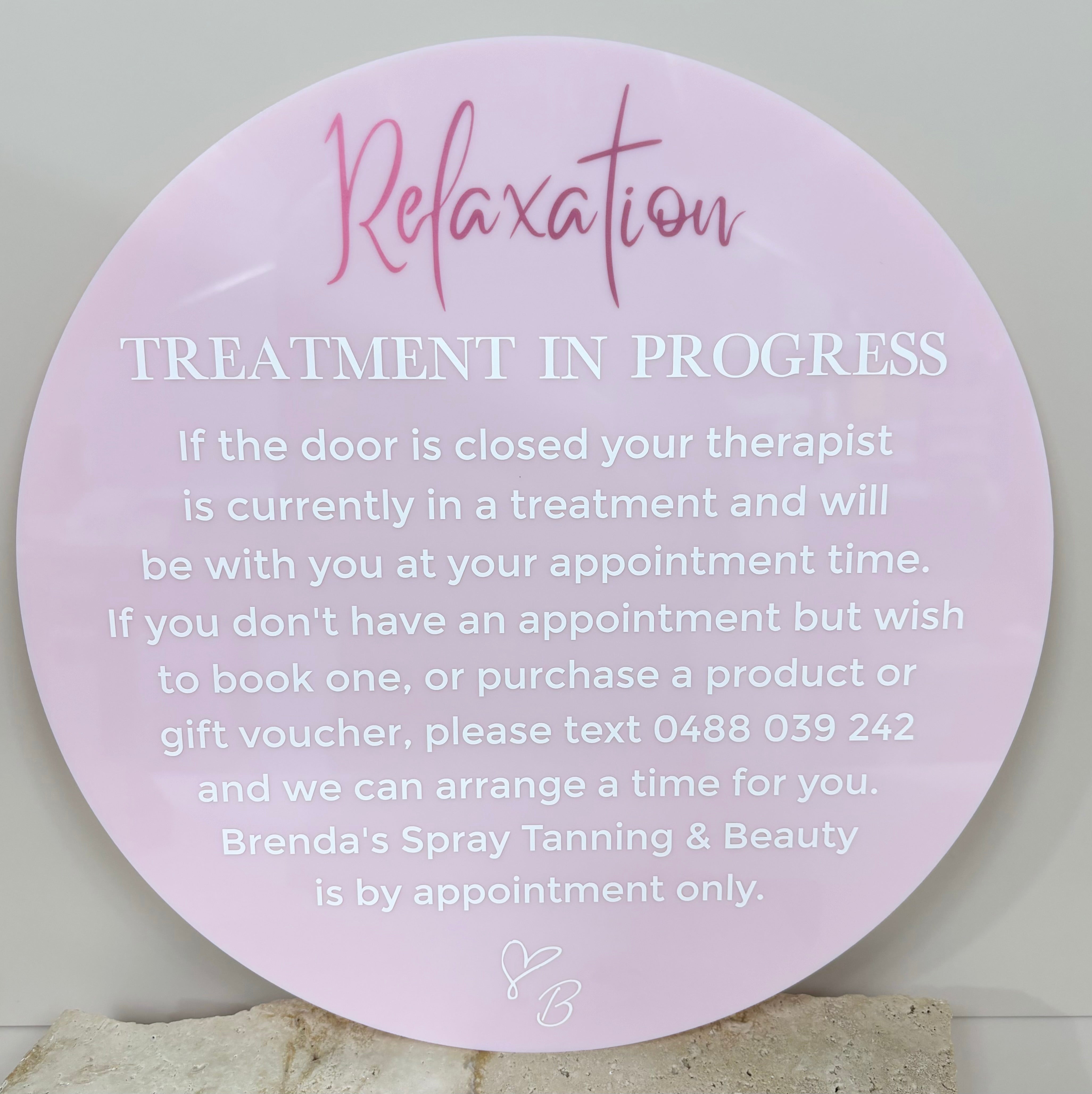 Pink treatment in progress acrylic sign with salon branding