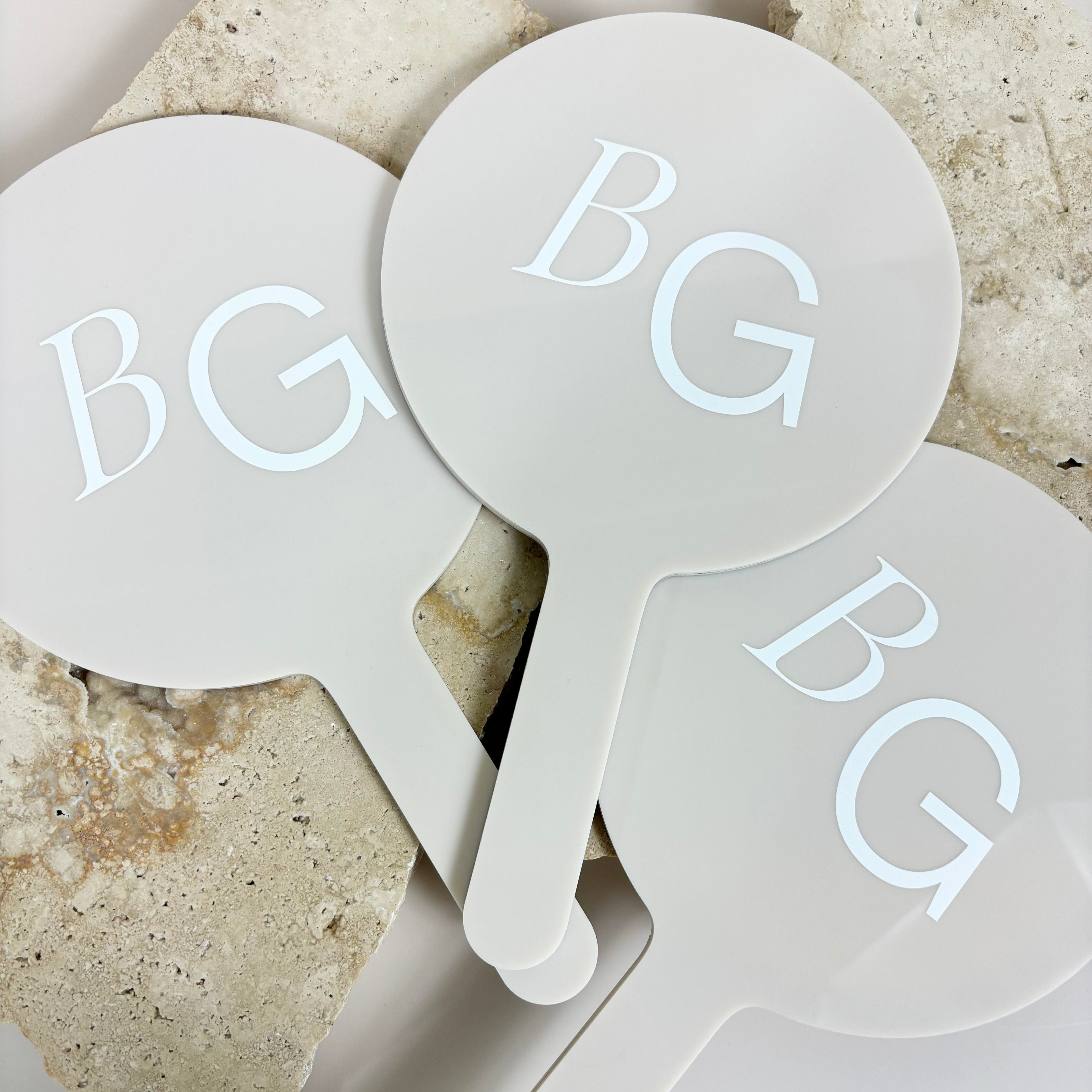 Set of personalised round mirrors with BG logo for beauty businesses